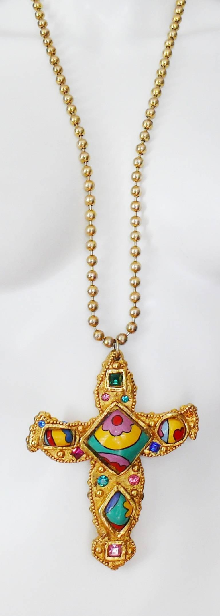 ALEXIS LAHELLEC vintage rare pendant necklace featuring an oversized resin cross embellished with handpainted polychrome abstract design papier-mâché cabochons and multicolored crystals.

Gold toned ball chain.

Marked ALEXIS LAHELLEC