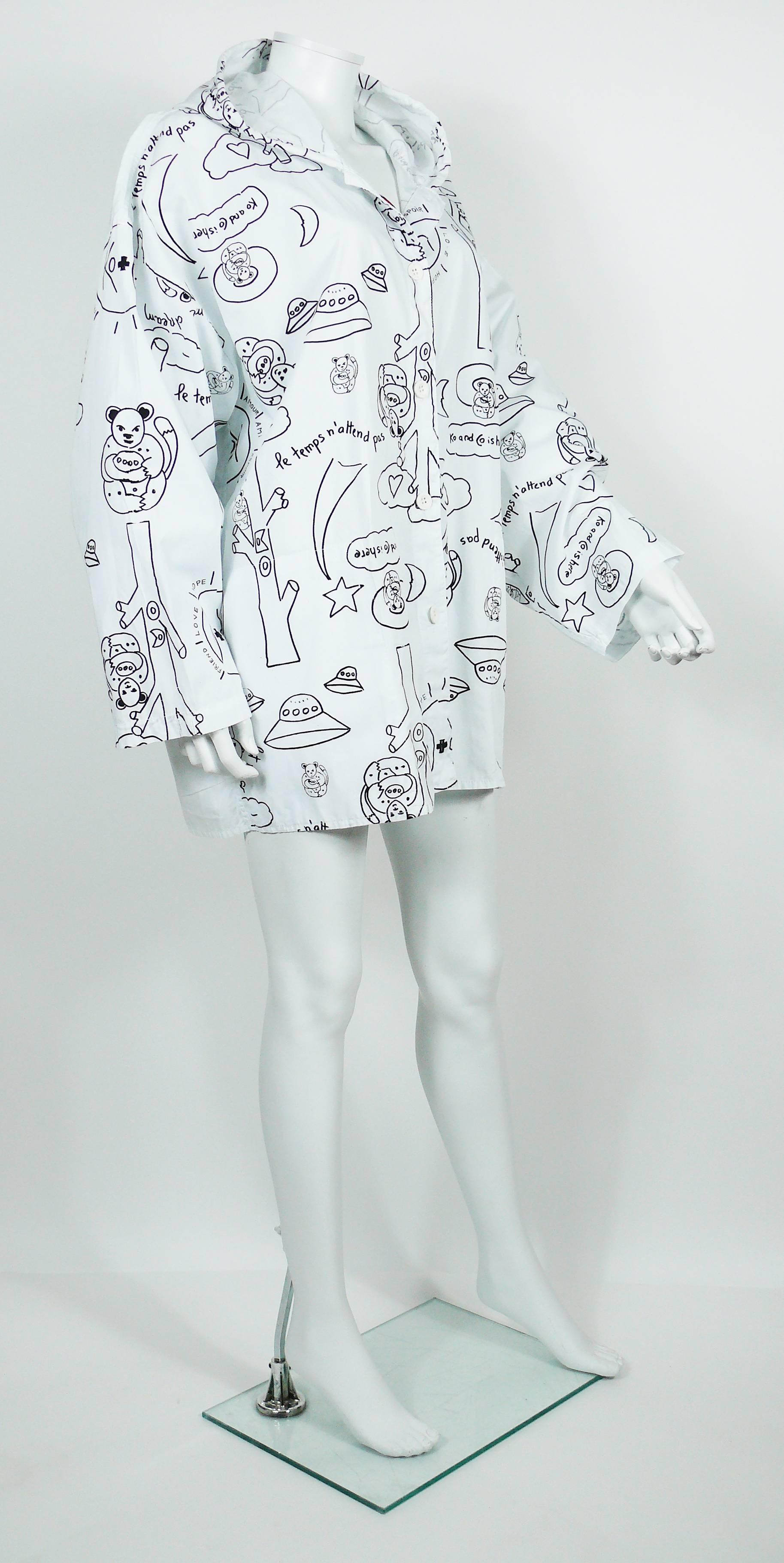 KO and CO vintage white cotton hooded jacket featuring an opulent design art print, white button front fastening, long sleeves and two pockets. 

Label reads KO and CO.

Composition label reads : 100 % Cotton.

Indicated size : 2.

Indicative