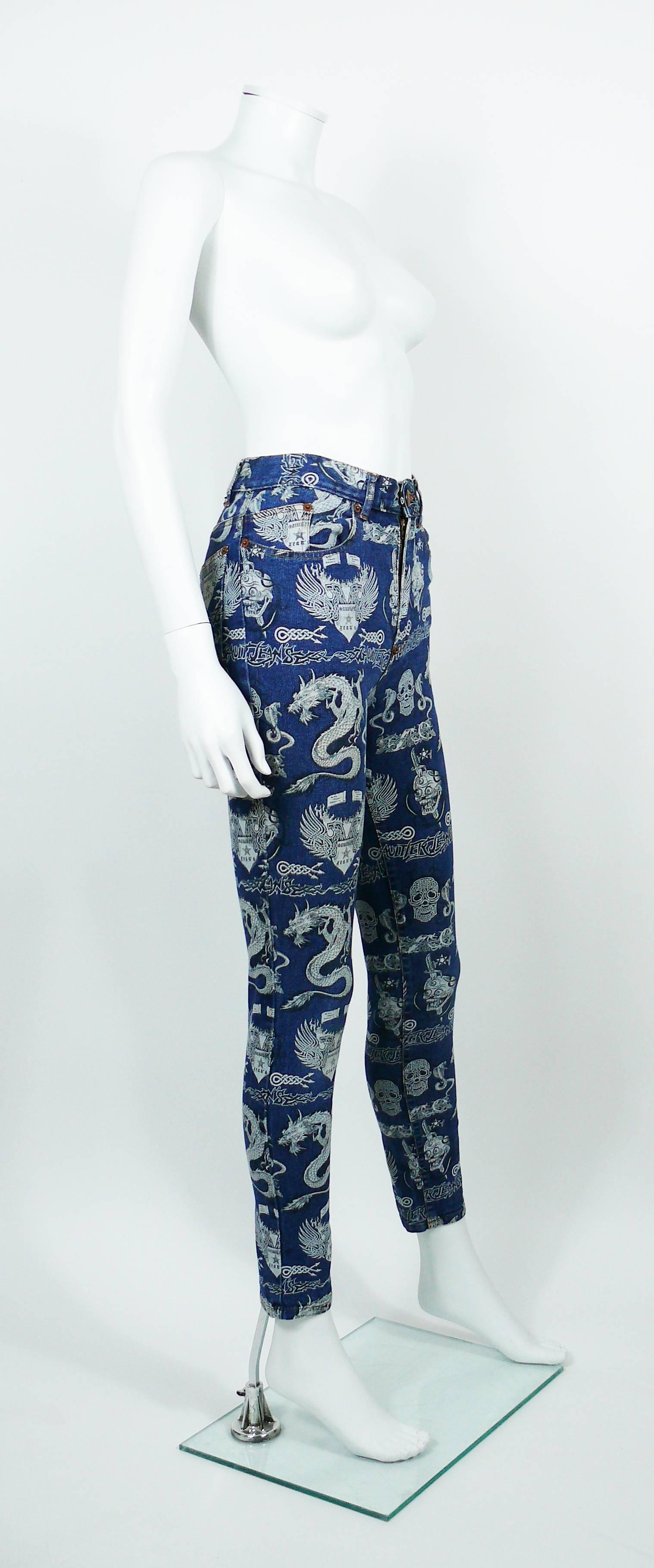 JEAN PAUL GAULTIER vintage high waisted skinny denim pants trousers featuring various tattoo designs : skulls, dragons, cobras, Gaultier Jean's insignas....

These trousers feature :
- Stretchy blue denim jeans featuring white designs throughout.
-