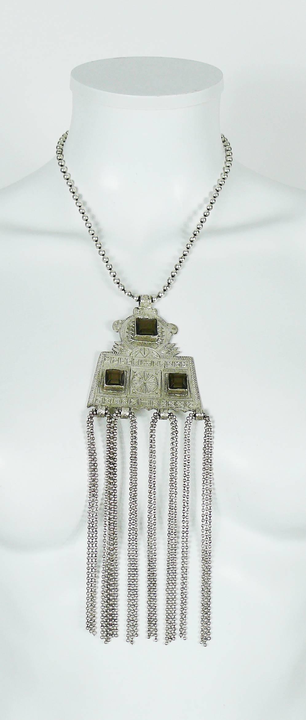 JEAN PAUL GAULTIER antiqued silver toned necklace featuring a Touareg style pendant embellished with smoky topaz resin crystals and tassels.

Ball chain.

Hook clasp.
Extension chain.

Marked GAULTIER.

Indicative measurements : max. chain length