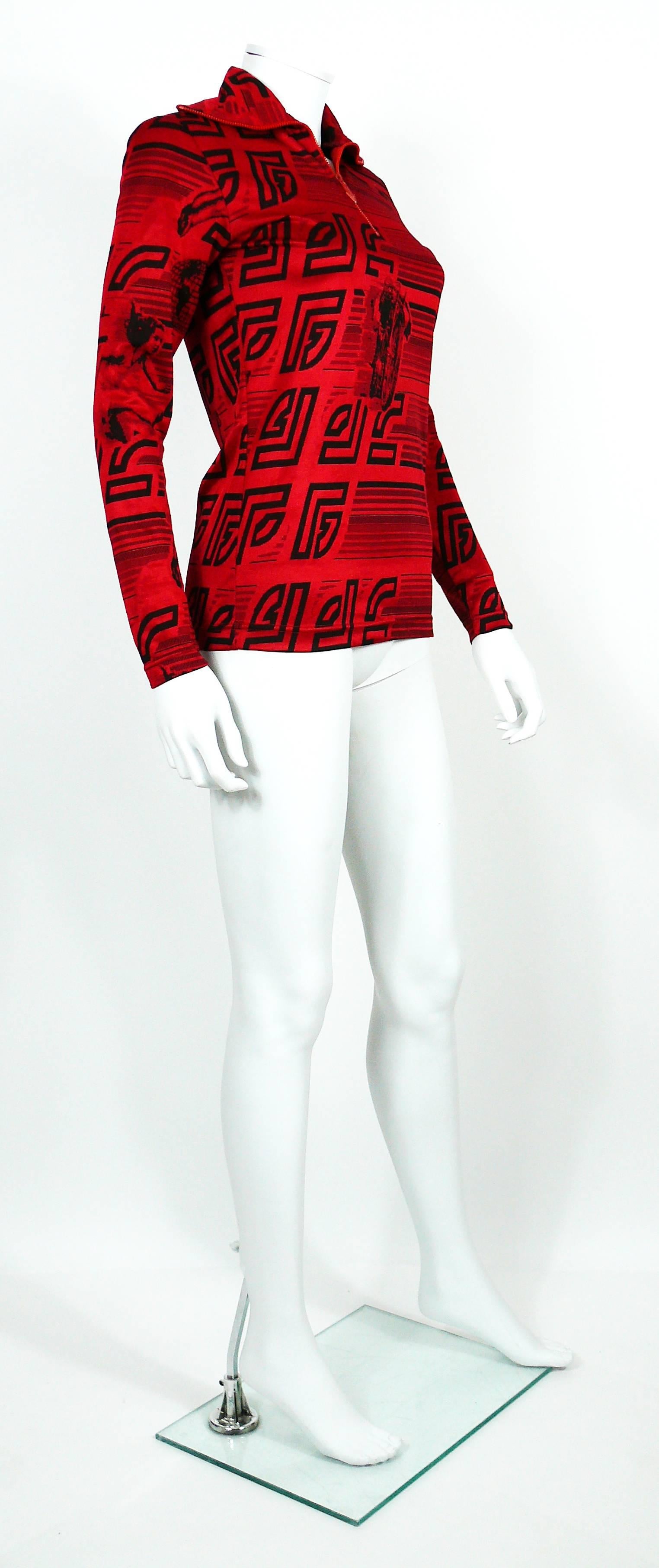 JEAN PAUL GAULTIER vintage red/black Olympic print top.

This top features :
- Athlete figures, world and JPG logo prints.
- Zip neck.
- Long sleeves.

Label reads JPG Paris Made in Italy.

Composition tag reads : 100% Polyester.

Size tag reads :