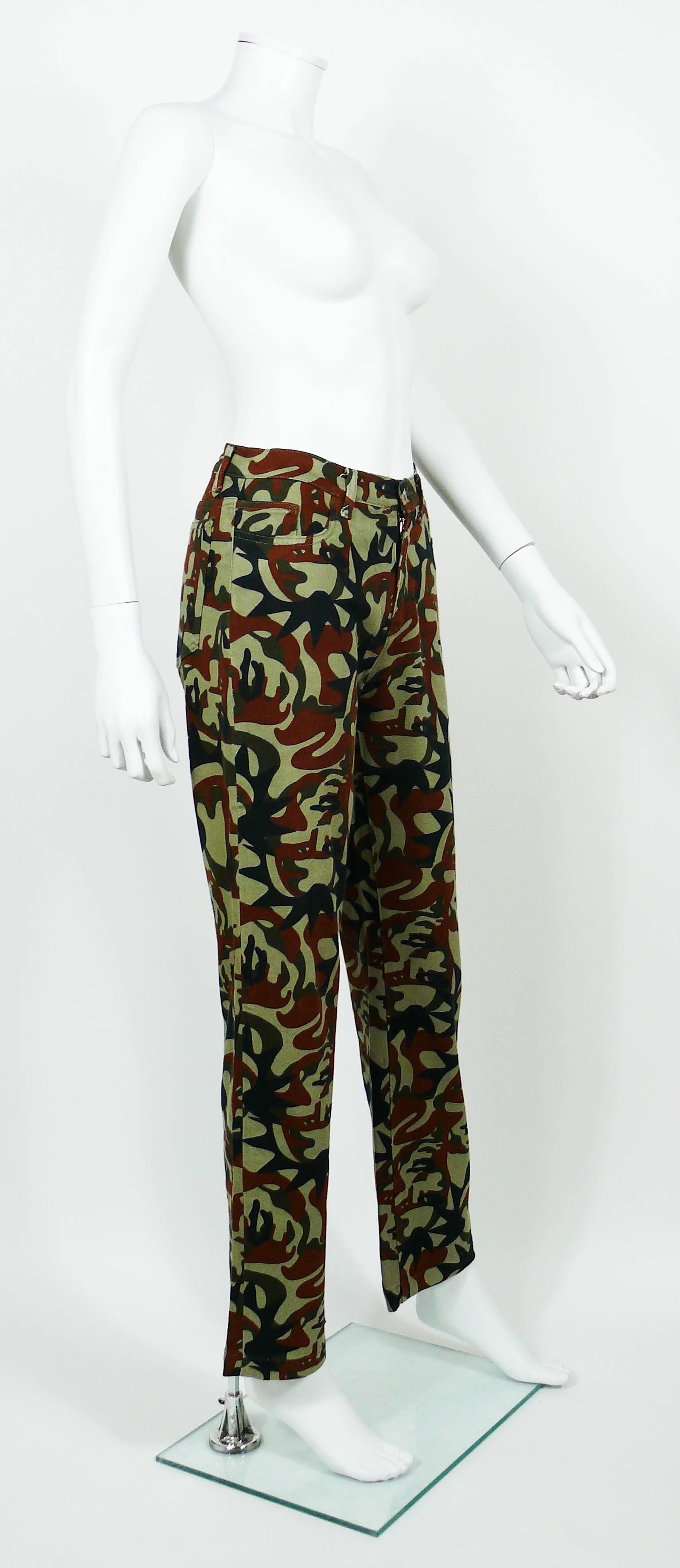 JEAN PAUL GAULTIER vintage pants trousers featuring a camouflage design with faces.

These trousers feature :
- Stretchy fabric.
- Front zip closure.
- Front and back pockets.
- Belt loops and signature brand loop at the back.

Label reads JPG