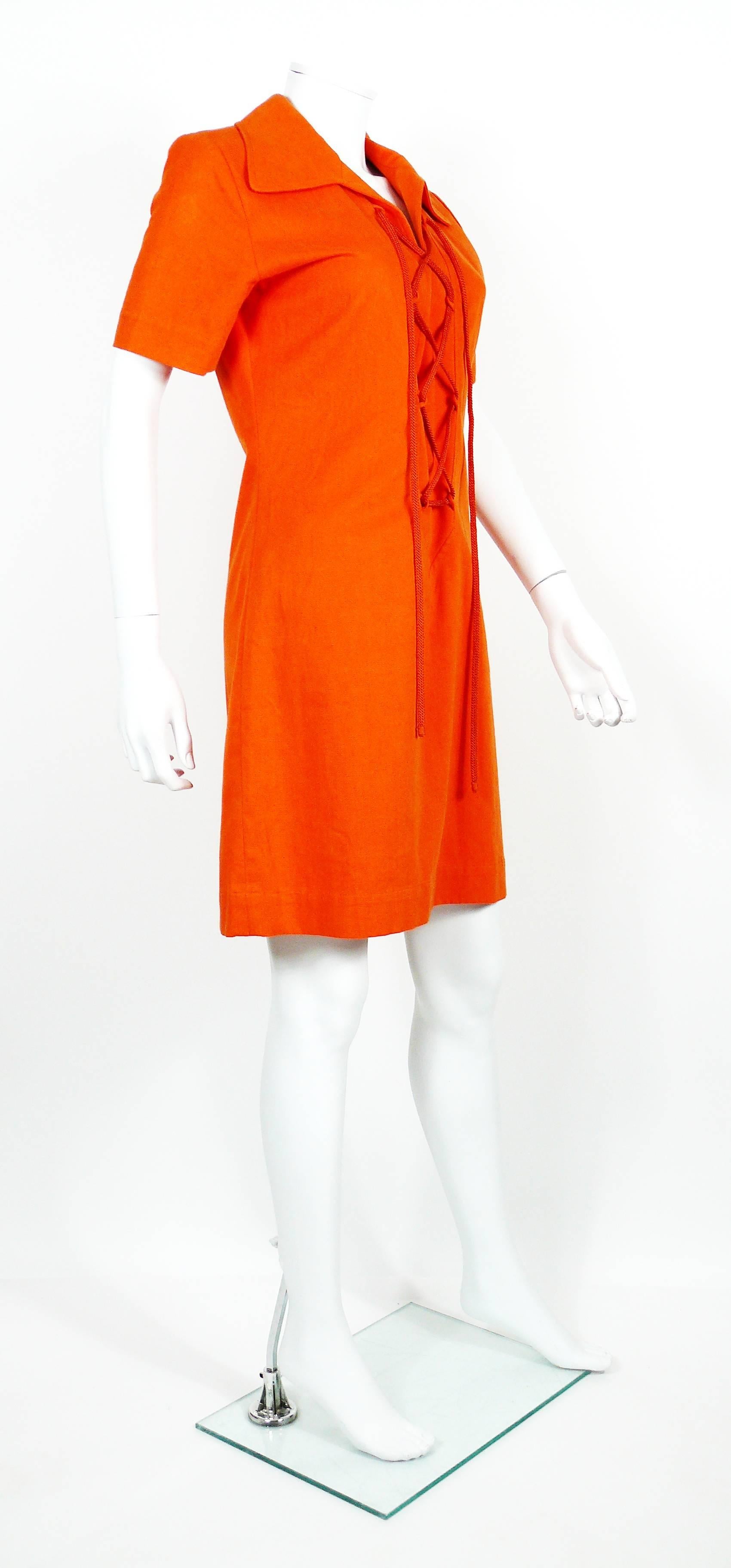 YVES SAINT LAURENT RIVE GAUCHE vintage 1980s Safari dress in bright burnt orange cotton fabric featuring lace-up front with original orange cord and a side slit.

Label reads YVES SAINT LAURENT RIVE GAUCHE Paris.
Made in France.

Size label reads :