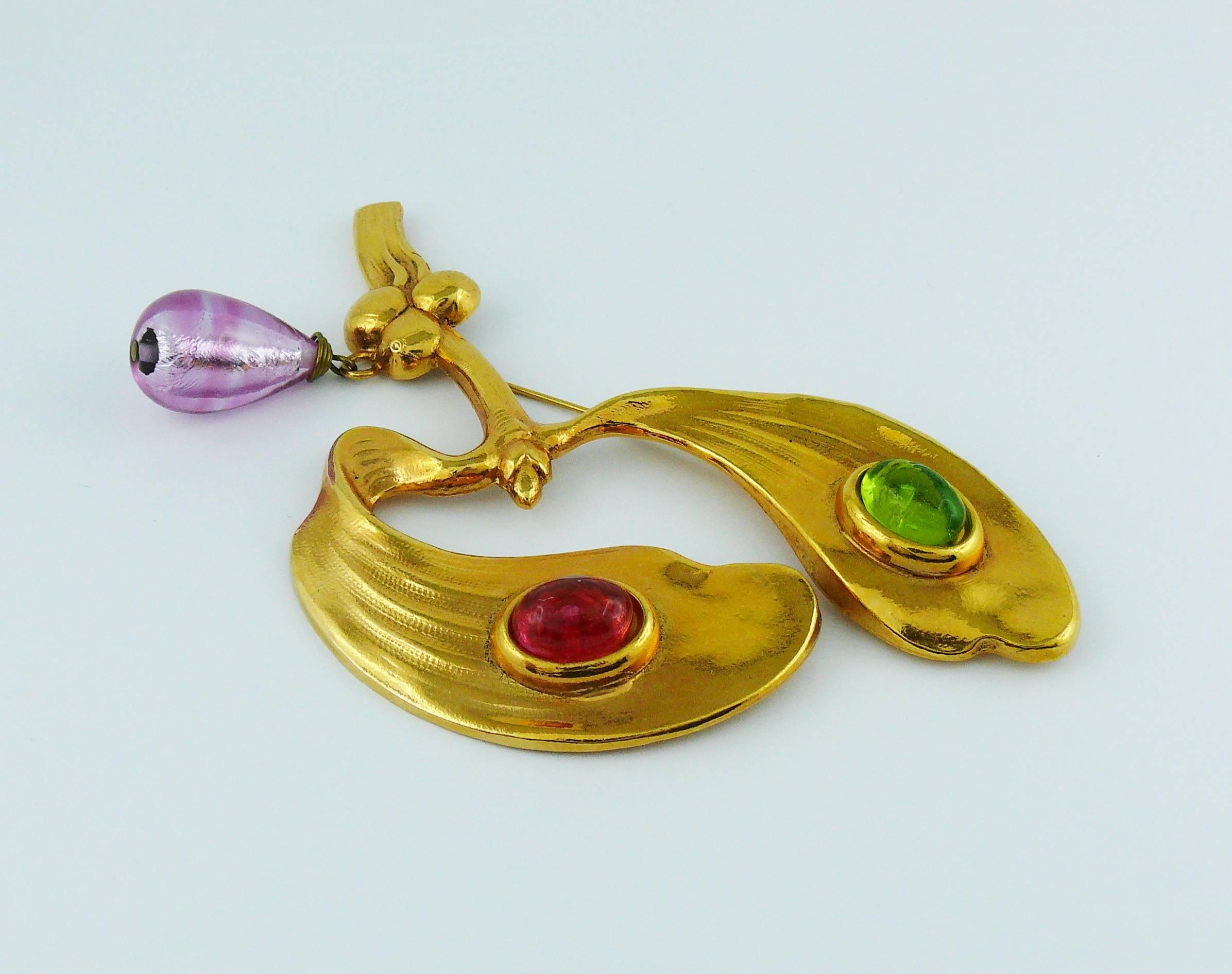 MERCEDES ROBIROSA vintage large gold toned naturalist brooch featuring an Art Nouveau inspired branch embellished with multicolored glass cabochons and glass drop.

Embossed MERCEDES ROBIROSA.

Indicative measurements : max. length approx. 12 cm