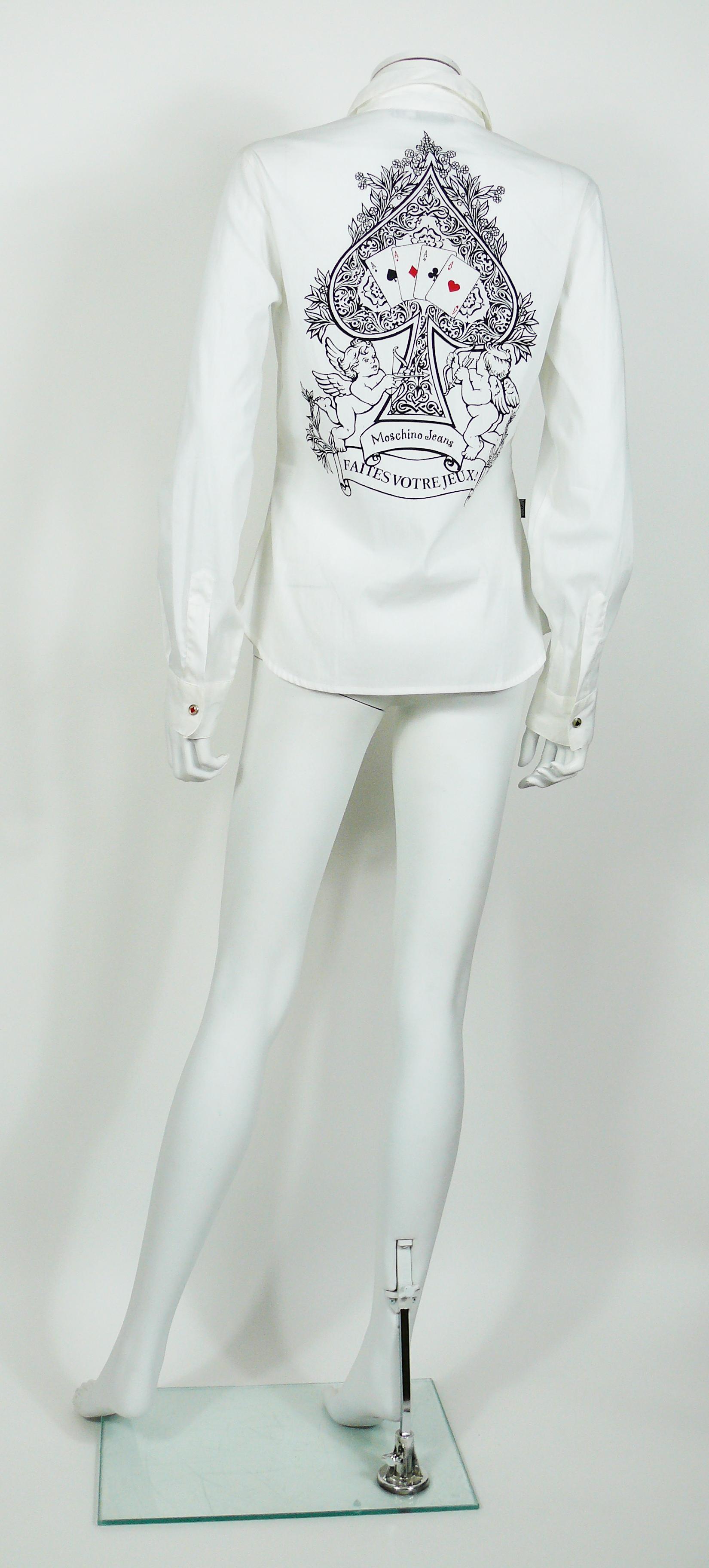 MOSCHINO vintage FAITES VOTRE JEUX white shirt featuring card suit snap buttons.

Label reads MOSCHINO JEANS.
Made in Italy.

Size tag reads : I 44 / USA 10 / F 40 / GB 14 / D 40.
Please refer to masurements.

Composition tag reads : 77% Cotton /