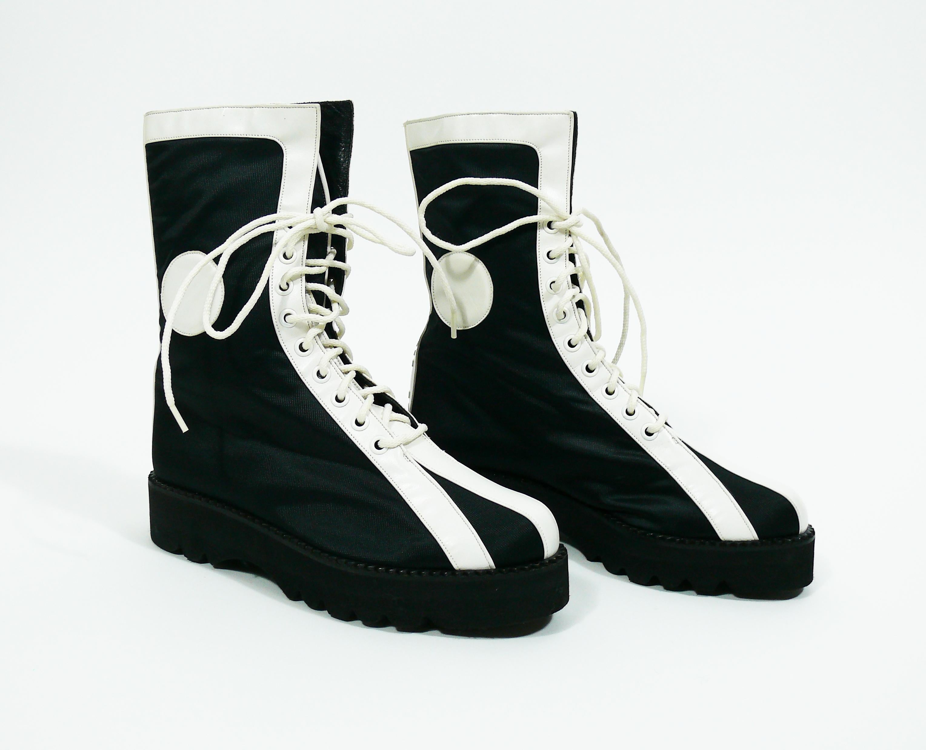 KARL LAGERFELD vintage rare black white lace up combat boots from the 1990s.

These boots feature :
- Lightweight black synthetic material body with white leather details.
- Lace up front.
- Platform soles.
- Lagerfeld lettering signature.
- Black