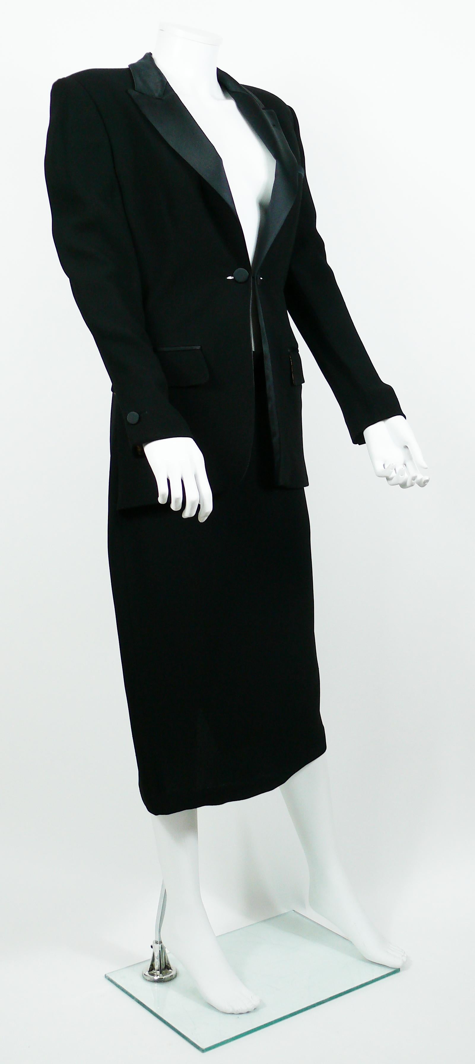 JEAN PAUL GAULTIER vintage rare and iconic black tuxedo dress.

This dress features :
- Black satin lapels.
- Zippered back with hook closure.
- Two buttons at the center front.
- Satin cuff buttons.
- Three satin trimmed pockets (still sewn).
-