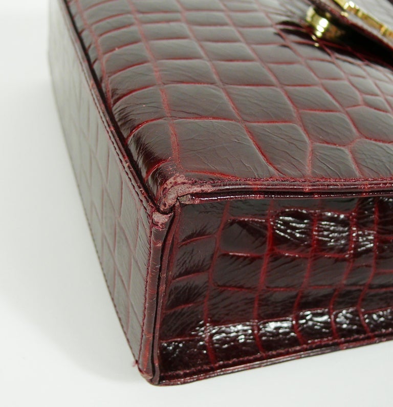 SAINT LAURENT - Black Vintage Shiny Crocodile Embossed Uptown Pouch –  thevintagecaffe