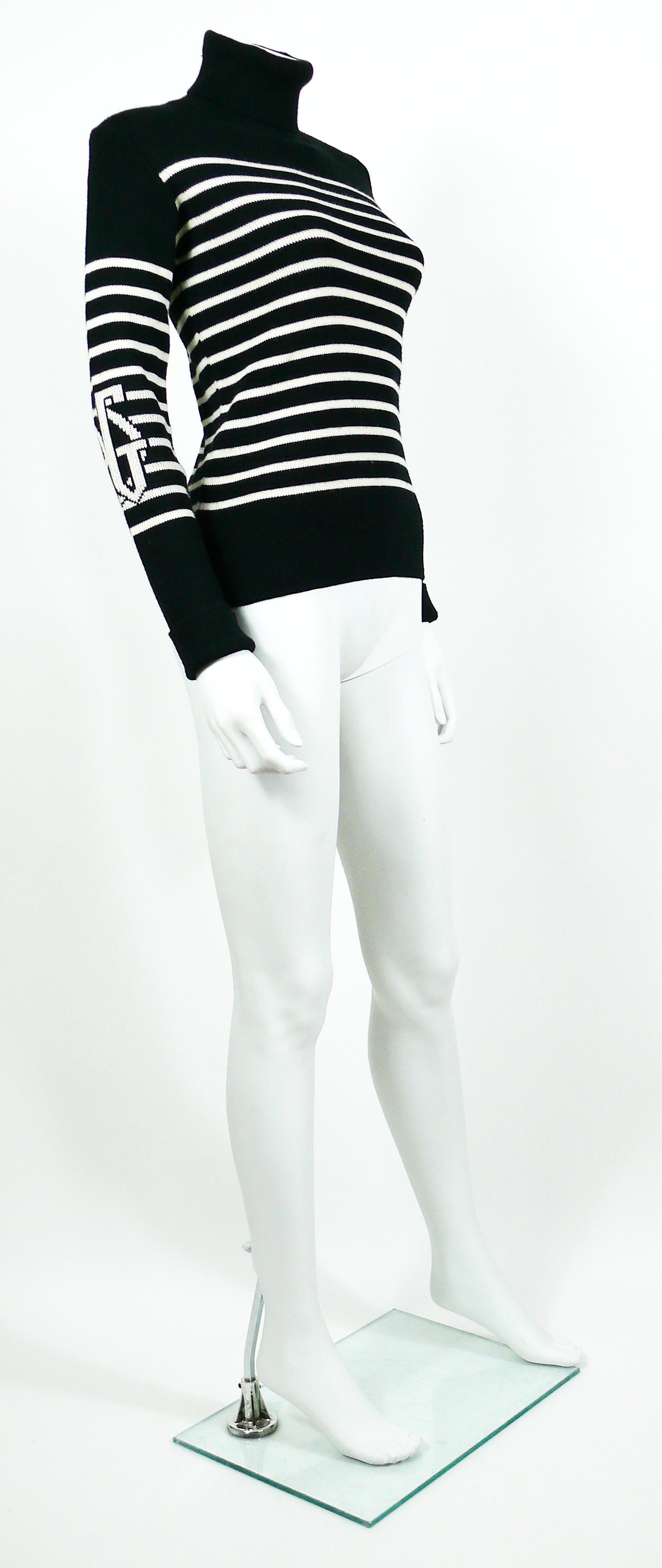 JEAN PAUL GAULTIER vintage iconic wool blend black/white matelot sweater featuring large a JPG monogram on each sleeve.

Turtle neck.
Long sleeves.

Label reads JPG JEAN'S.
Made in Italy.

Composition label reads : 50% Acrylic / 50% Wool / 9%