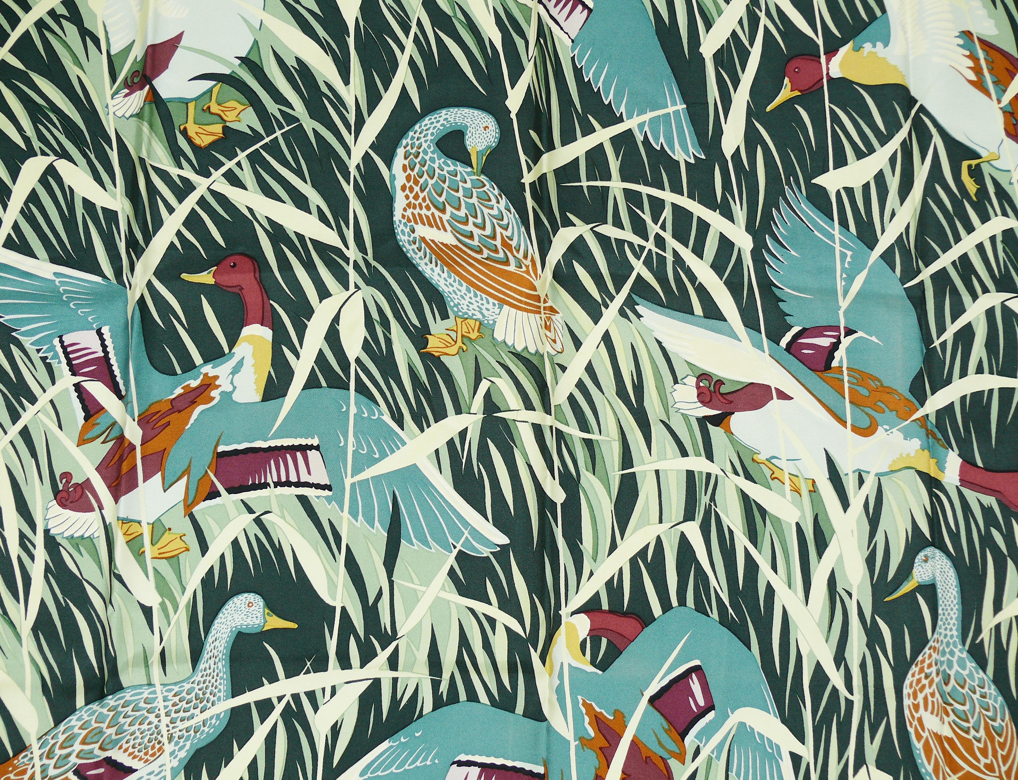 HERMES vintage silk carre scarf COLS VERTS featuring an opulent design of ducks in long grass.

Designed by CHRISTIANE VAUZELLES.

Issued in 1973.

Hand rolled borders.
100 % silk.
Missing composition and care tag.

Marked HERMES PARIS.

Indicative