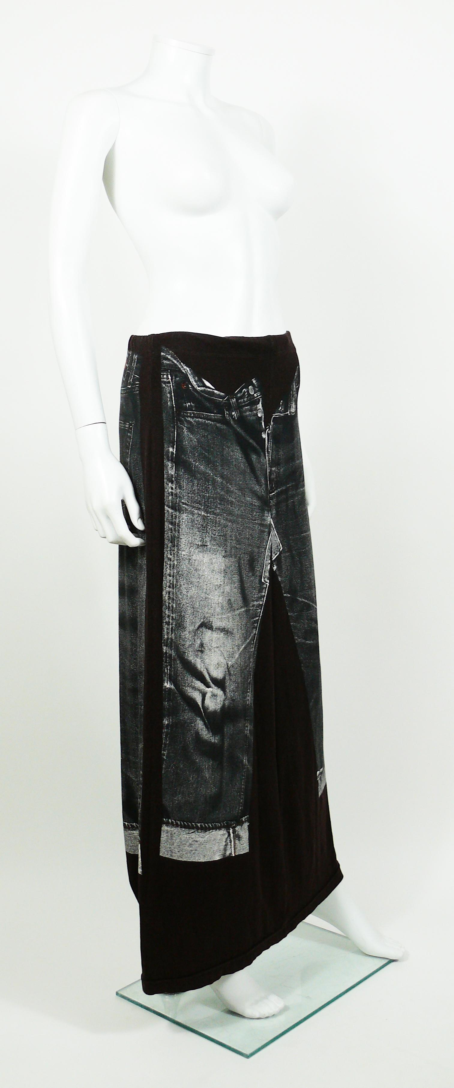 JEAN PAUL GAULTIER plum jersey maxi skirt with featuring an X-RAY screen trompe l’œil jeans on front and back.

This skirt features :
- Plum jersey background featuring distressed black/white x-ray screen trompe l’œil jeans.
- Maxi length.
-