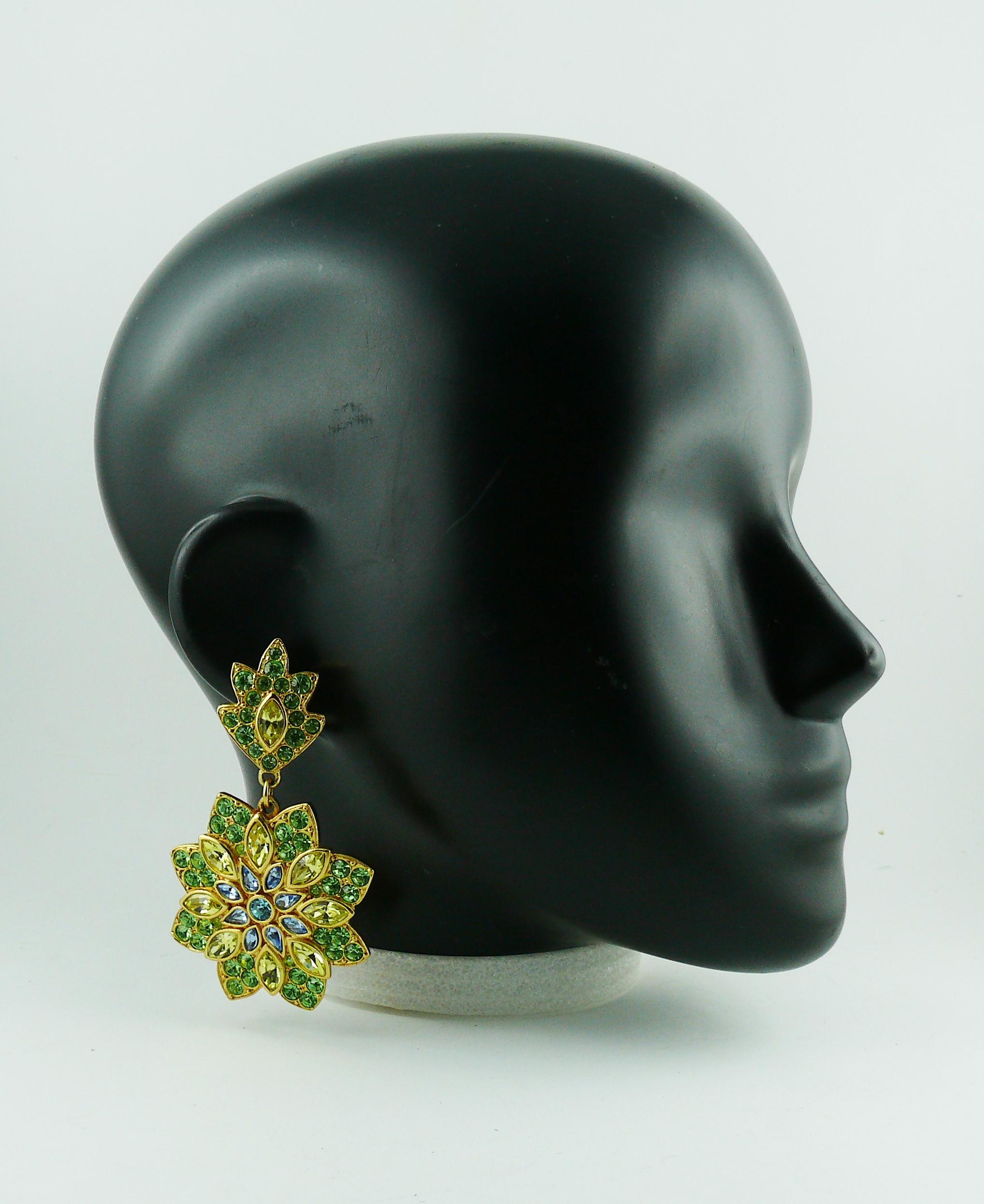 YVES SAINT LAURENT vintage gold toned dangling earrings (clip on) featuring a massive flower embellished with multicolored crystals.

Embossed YSL Made in France.

Indicative measurements : max. height 8.2 cm (3.23 inches) / max. width approx. 4.8