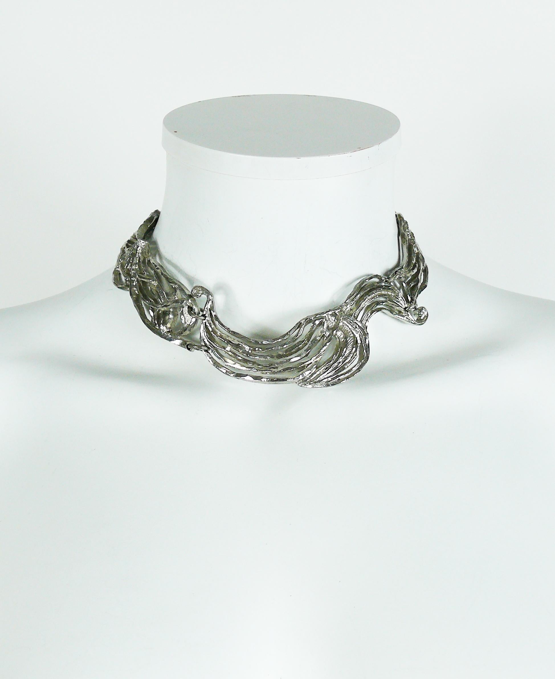 CHRISTIAN LACROIX silver toned collar necklace featuring a gorgeous openwork design.

Hook clasp closure.
Extension chain.

Marked CHRISTIAN LACROIX CL Made in France.

Indicative measurements : max. circumference approx. 36.13 cm (14.22 inches) /