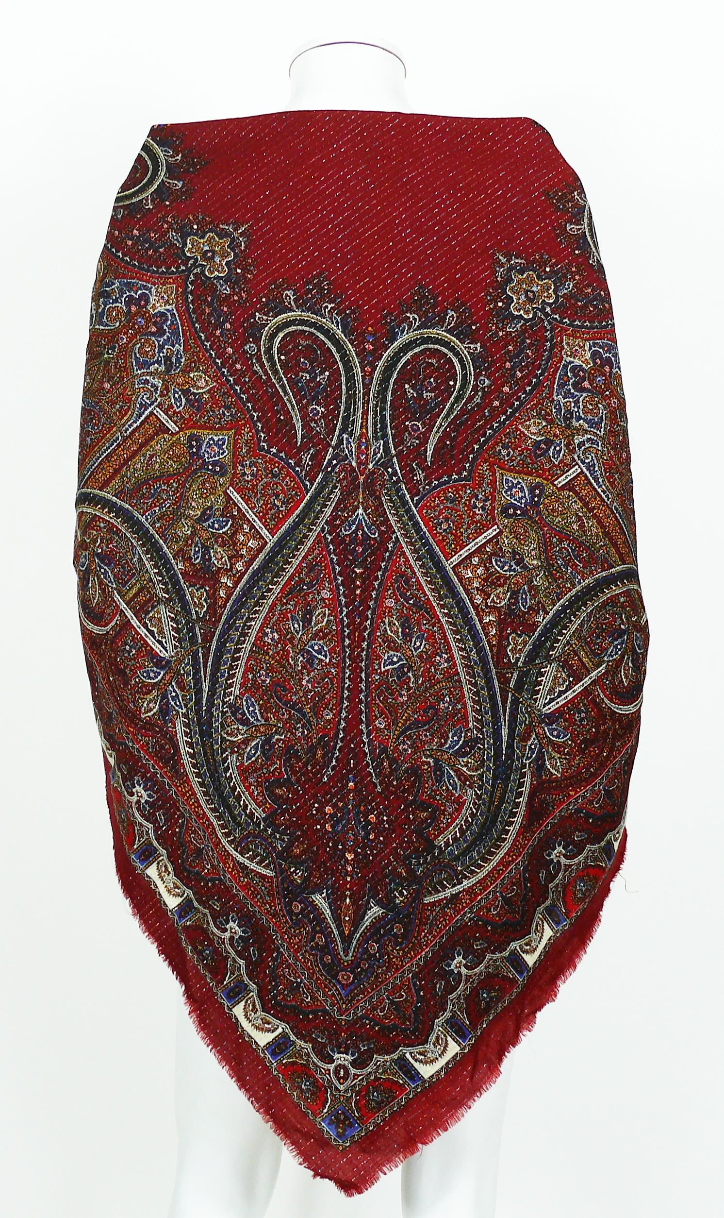 YVES SAINT LAURENT vintage paisley shawl featuring an opulent design with lurex threads on a deep red-burgundy background. Fringe around the edges.

Please note that true colors are closer to photos 2 and 10.

YSL logo.

Label reads YVES SAINT