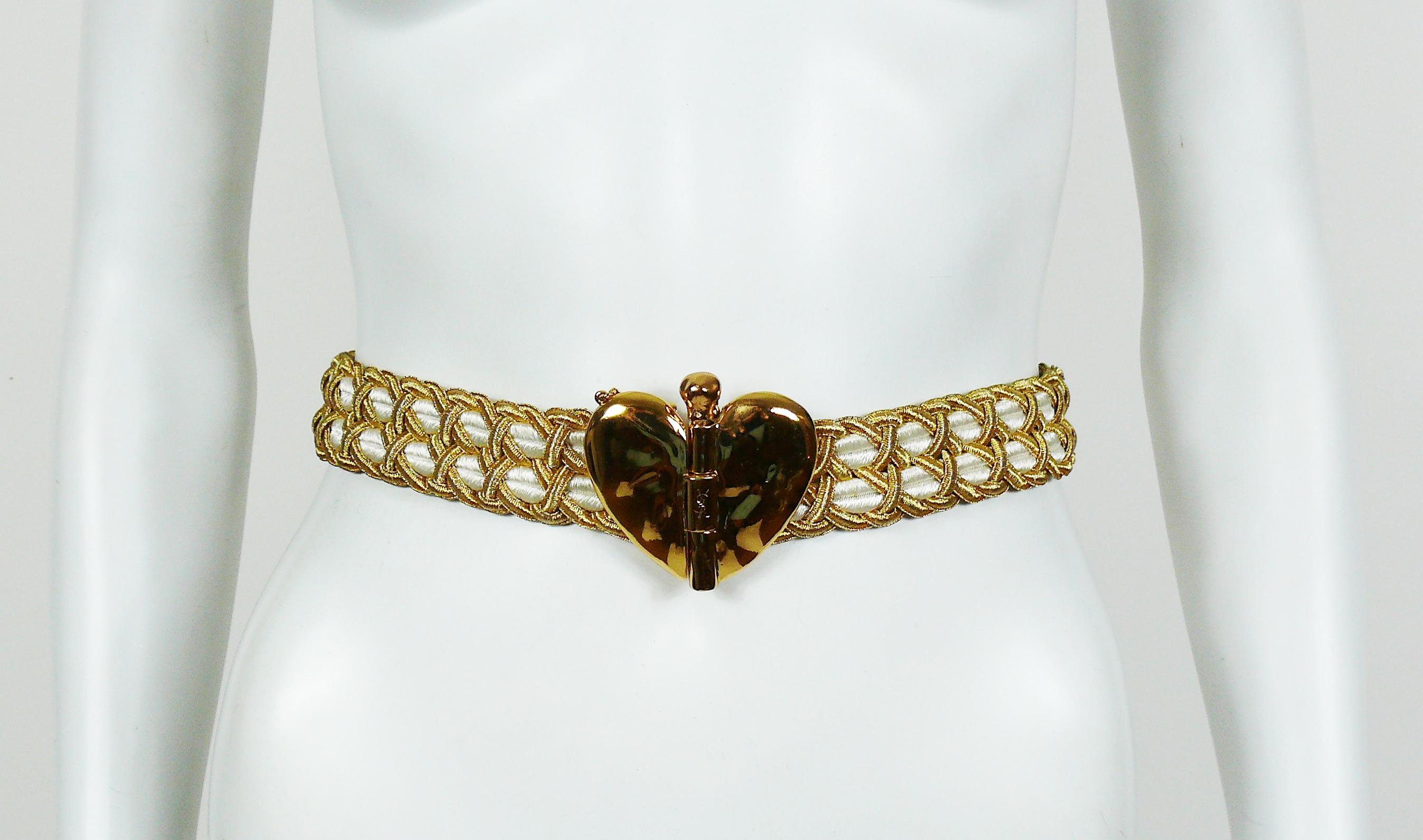 YVES SAINT LAURENT vintage gold and white passementerie belt featuring a large gold toned heart buckle.

Embossed YSL.

Indicative measurements : length approx. 79.5 cm (31.30 inches) / strap width approx. 3 cm (1.18 inches) / buckle approx. max.