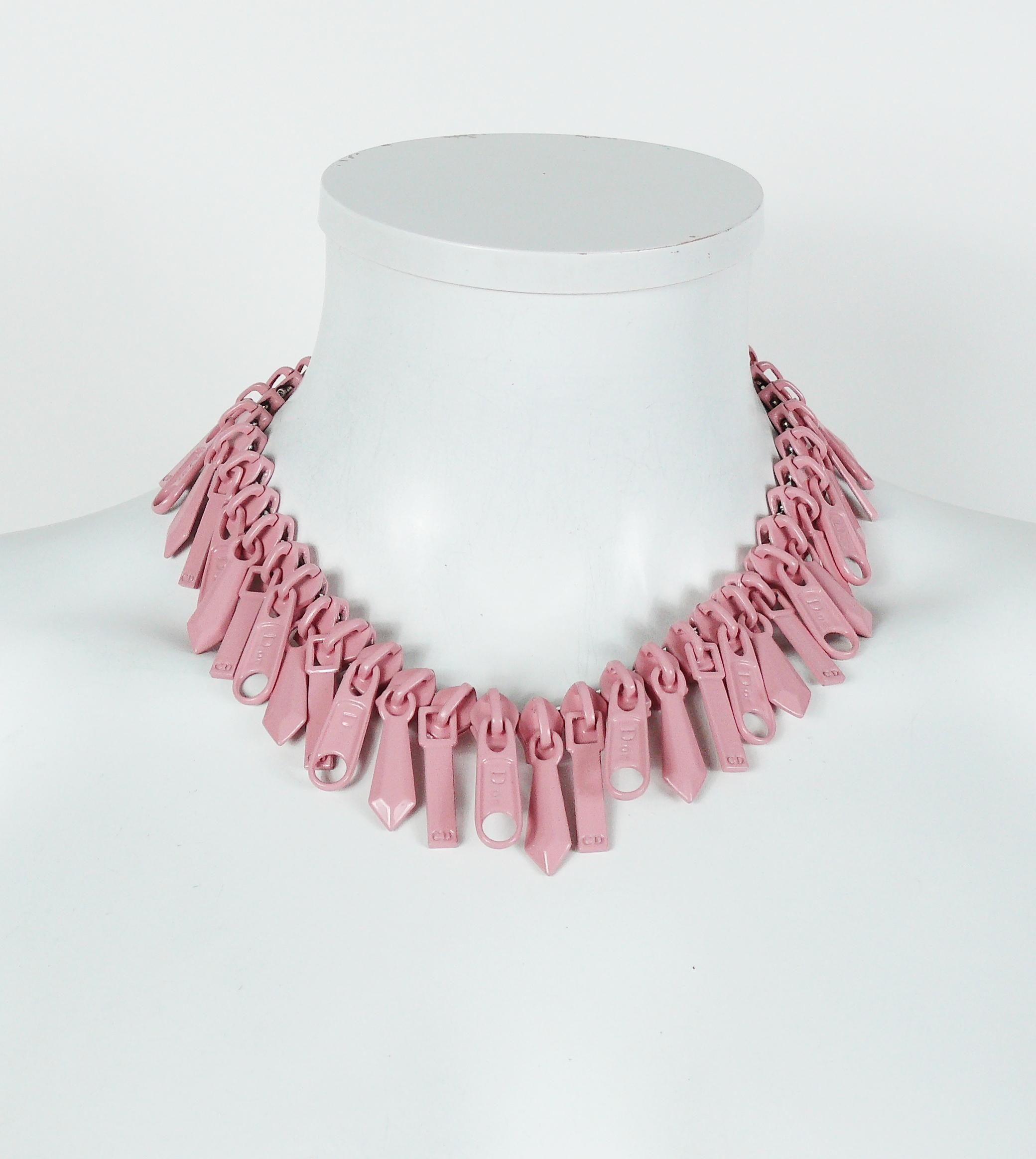 CHRISTIAN DIOR rare silver toned necklace featuring numerous pink enamel zipper cursors, some embossed DIOR, others CD.

Lobster clasp closure.
Adjustable length.

Embossed DIOR on the clasp/

Indicative measurements : adjustable length from approx.