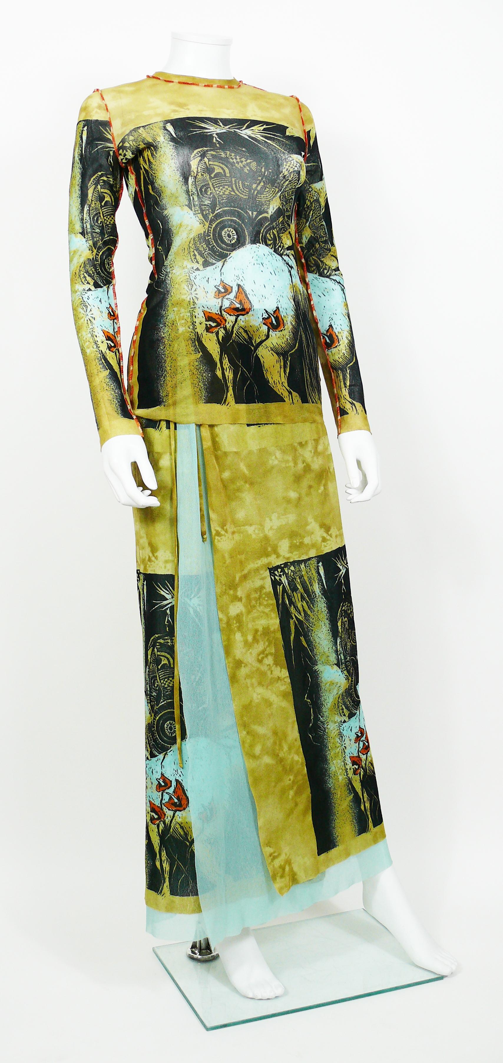 JEAN PAUL GAULTIER vintage Maori print sheer mesh ensemble featuring a maxi length skirt and a matching top.

SKIRT
- Wrap around with elasticated waist line.
- Maxi length.
- Self tie waist (with two straps).
- Lined with turquoise mesh.
- Label
