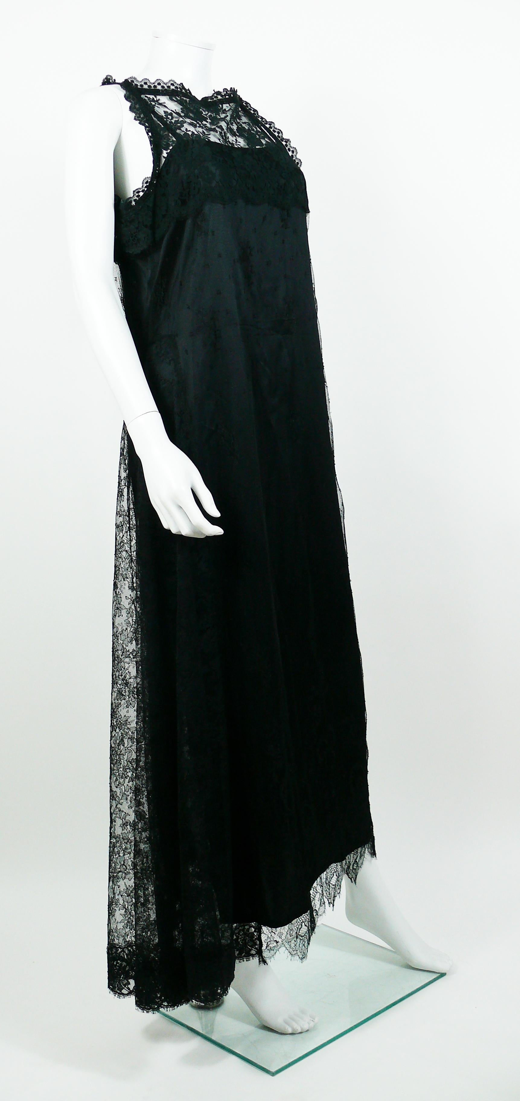 CHRISTIAN LACROIX vintage 1990s black lace maxi dress.

This dress features :
- A black lace sleeveless dress with removable black petticoat dress.
- Maxi length.
- Side slit.
- Back buttoning.
- Snap buttons on shoulders to assemble both dresses.
-