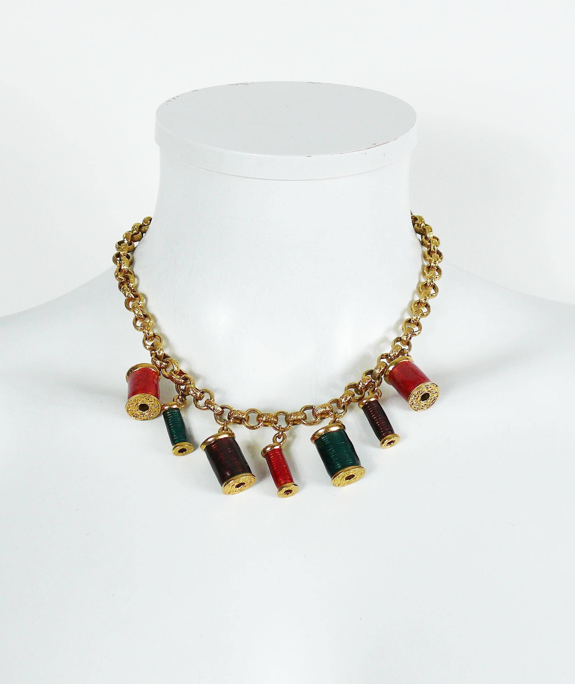 NINA RICCI vintage rare gold toned necklace featuring multicolored enamel sewing thread spool charms.

T-bar closure.

Embossed NINA RICCI.

Indicative measurements : length approx. 43 cm (16.93 inches).

JEWELRY CONDITION CHART
- New or never worn