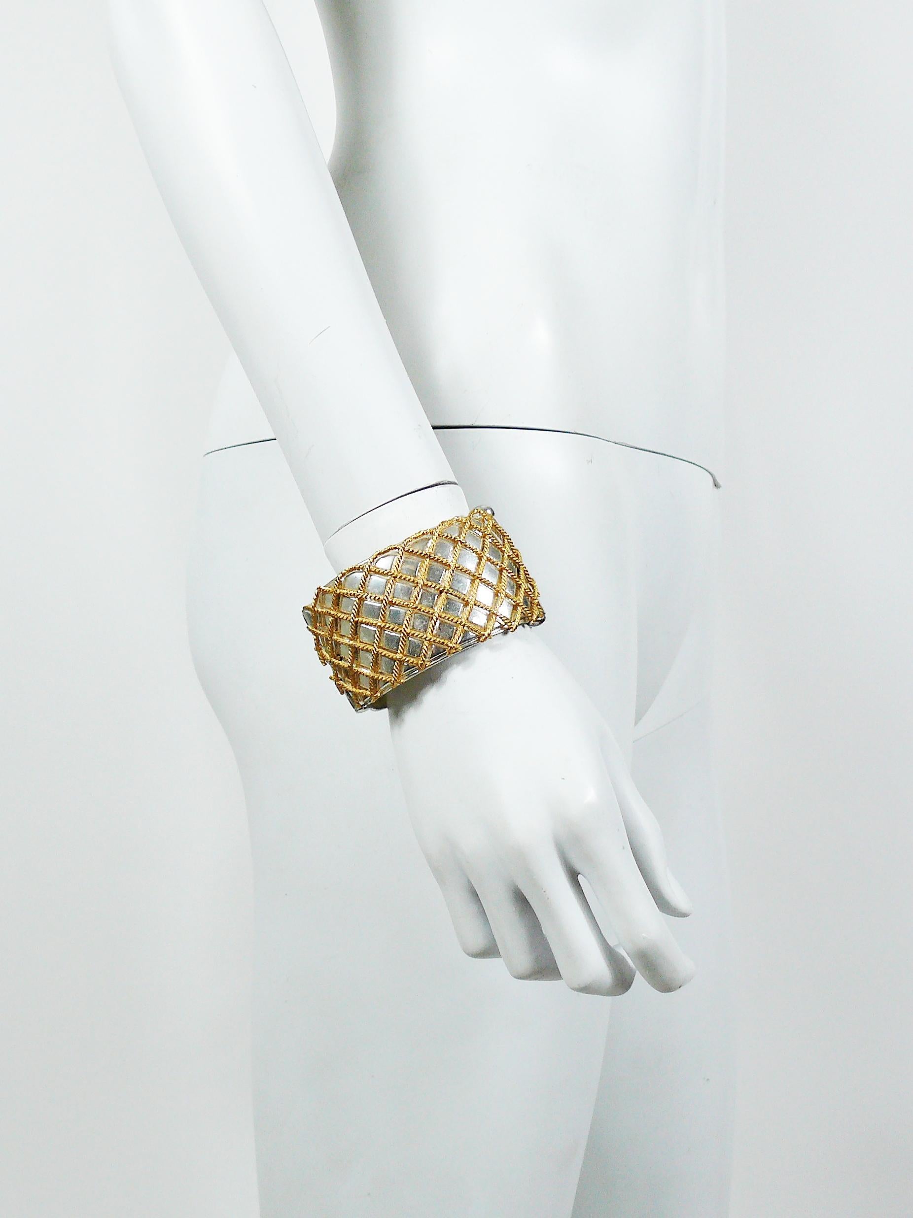 YVES SAINT LAURENT vintage two tone cuff bracelet featuring a grid design.

Embossed YSL Made in France.

Indicative measurements : inner length approx. 6.1 cm (2.40 inches) / inner width approx. 5.1 cm (2 inches) / height approx. 4 cm (1.57