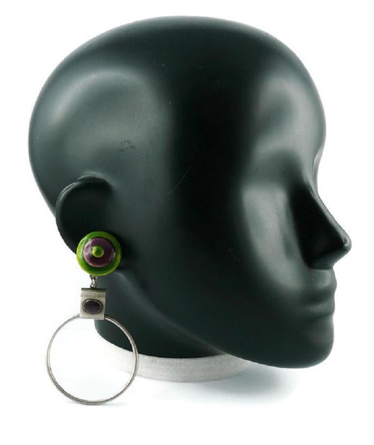 Jean Paul Gaultier vintage antiqued silver toned hoop (clip-on) earrings with enamel disc top in green and purple.

Marked GAULTIER.

Indicative measurements : length approx. 9 cm (3.54 inches) / max diameter approx. 5 cm (1.97 inches).

JEWELRY