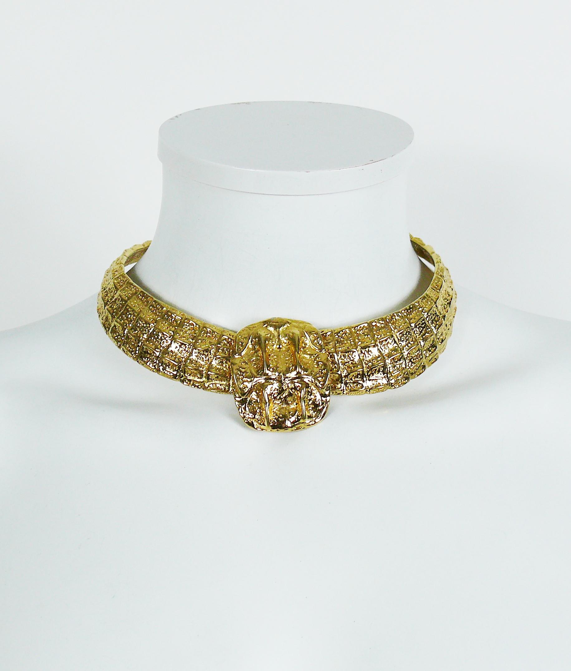 YVES SAINT LAURENT vintage gold toned choker necklace featuring a crocodile scale design.

Hook closure with extension chain.

Embossed YSL Made in France.

Indicative measurements : max. circumference approx. 42.40 cm (16.69 inches) / width approx.