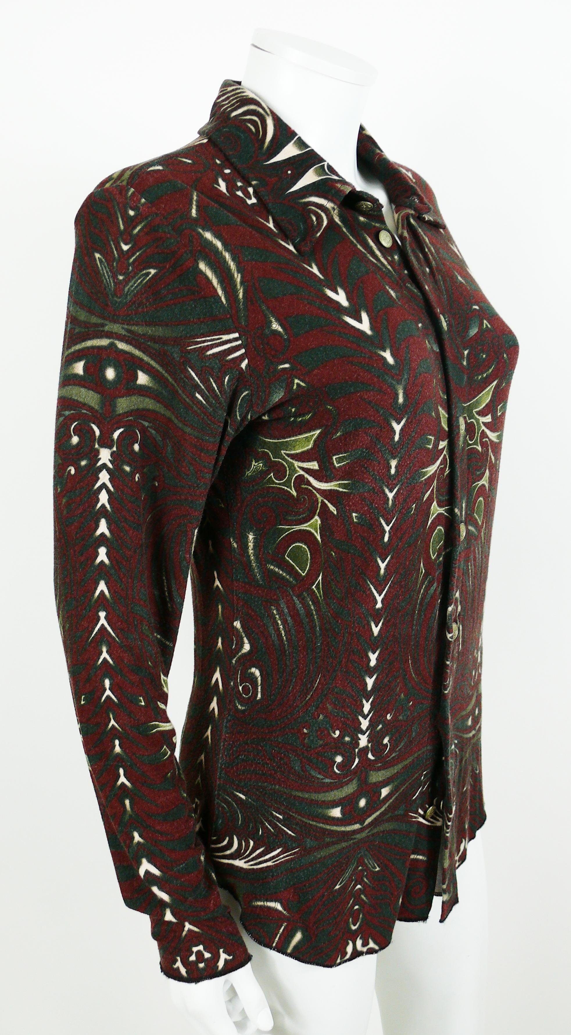 Jean Paul Gaultier vintage shirt featuring an opulent Aboriginal Maori tattoo print.

Stretchy material.
Please note that the surface of the fabric has a slight texture which is inherent part of the design.

Label reads GAULTIER JEAN'S.
Made in