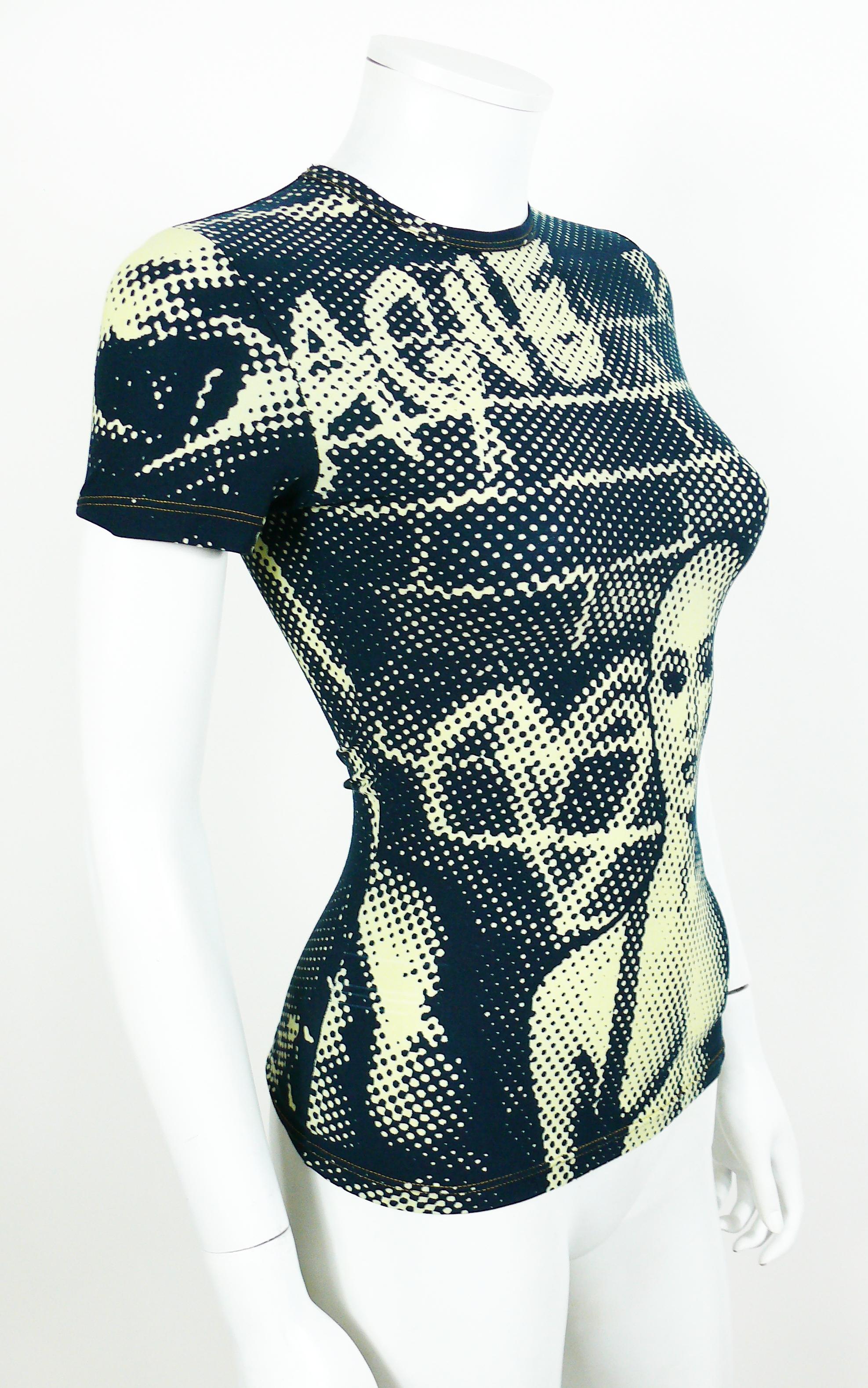 JEAN PAUL GAULTIER vintage shirt from the Fight Racism Collection featuring a dark blue and green/yellow optical illusion print.

Round neck.
Short sleeves.
Stretchy material.

Label reads GAULTIER JEAN'S.
Made in France.

Size tag reads :