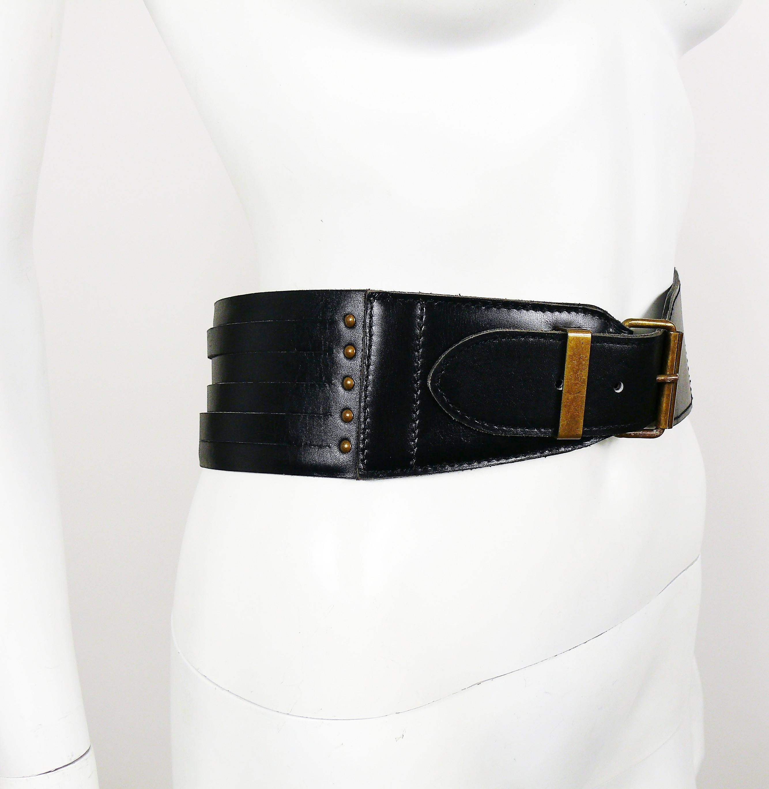 ALAIA vintage black high-waist leather belt featuring a back corset style design with several strips lacing and stud details on the sides.

Bronze toned hardware.

Marked ALAIA PARIS.
Made in France.

Indicated size : 75.
Please refer to