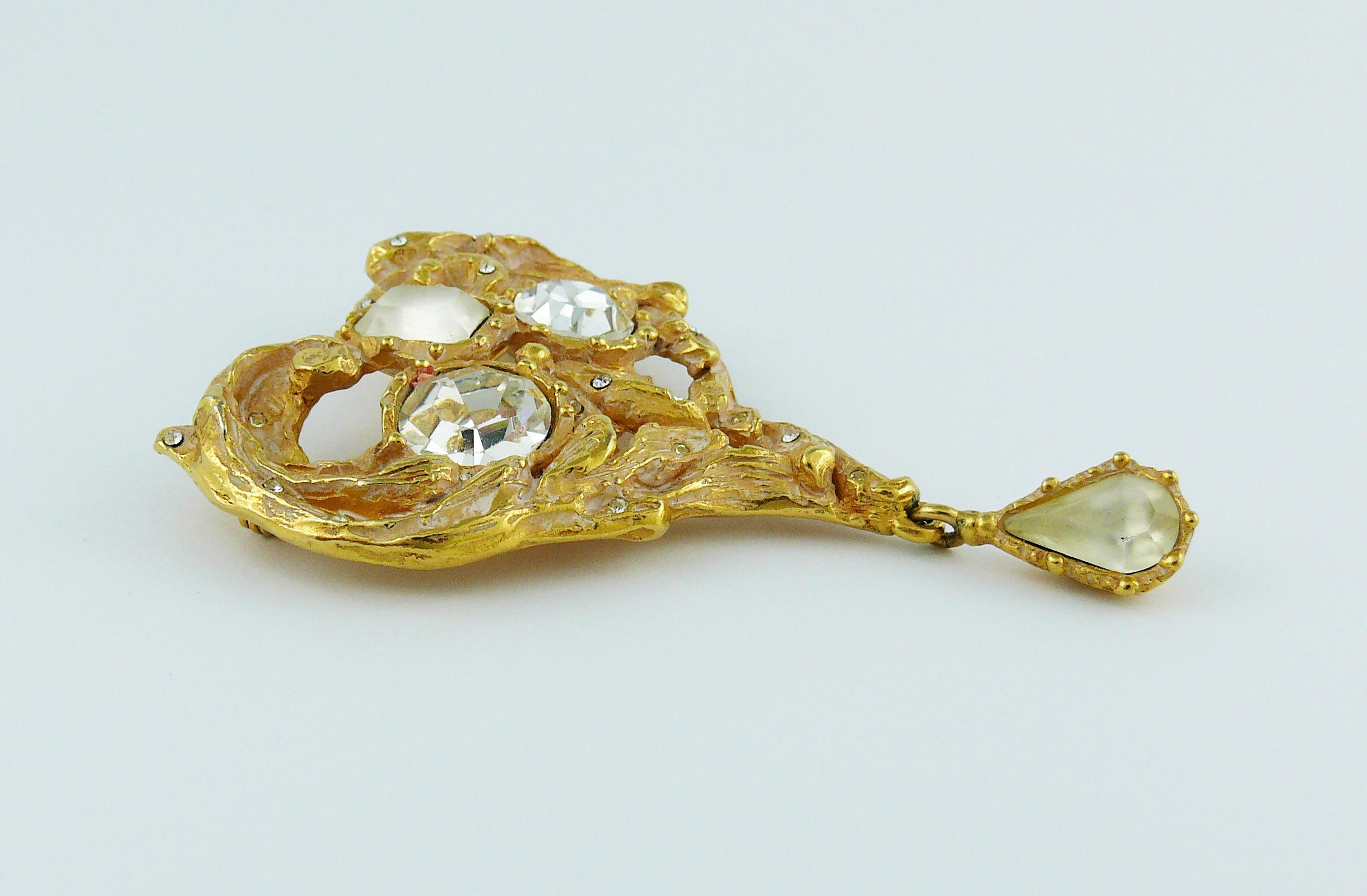 CHRISTIAN LACROIX vintage gold toned with patina heart brooch embellished with clear and frosted crystals.

Marked CHRISTIAN LACROIX CL Made in France.

Indicative measurements : height approx. 7.2 cm (2.83 inches) / max. width approx. 5.3 cm (2.09