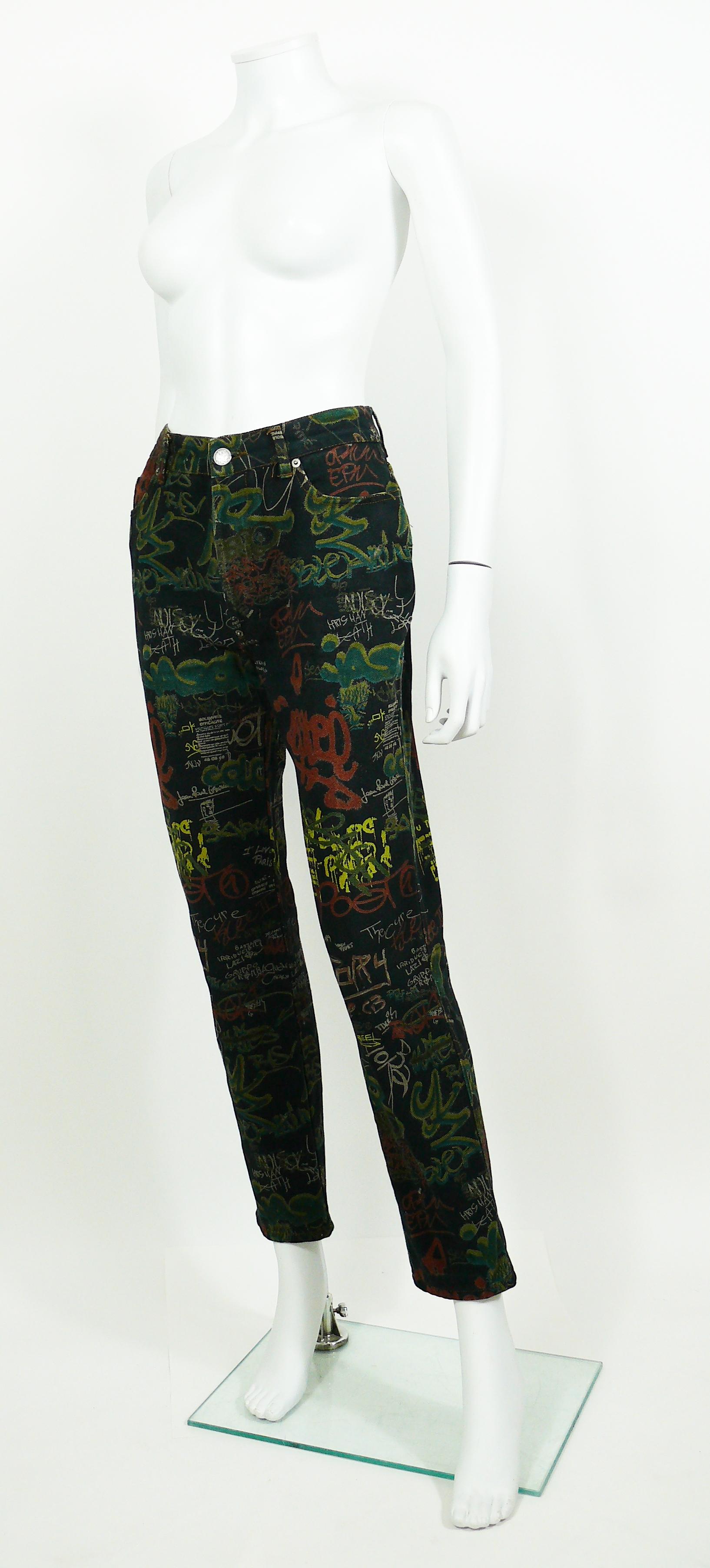 JEAN PAUL GAULTIER vintage denim pants trousers featuring an opulent multicolored graffitis print on a black background.

These trousers feature :
- Front buttoning.
- Front and back pockets.
- Belt loops and signature brand loop at the back.

Label