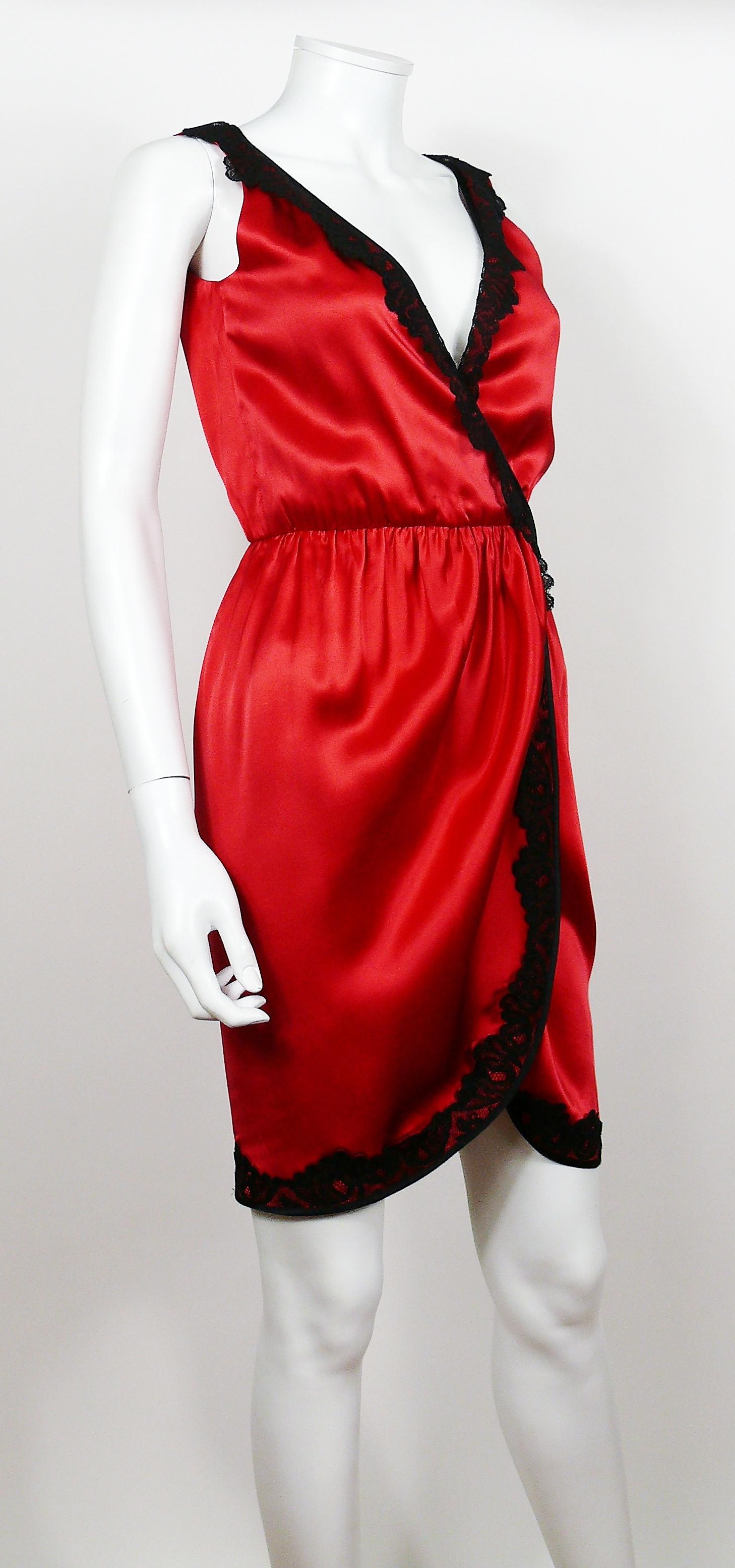 YVES SAINT LAURENT Rive Gauche vintage red silk wrap style dress with black lace trim.

This dress features :
- Red silk with black lace trim.
- Plunging bust.
- Wrapped waist (wrap on the interior with hooks closure, see photos 9 and 10).
-