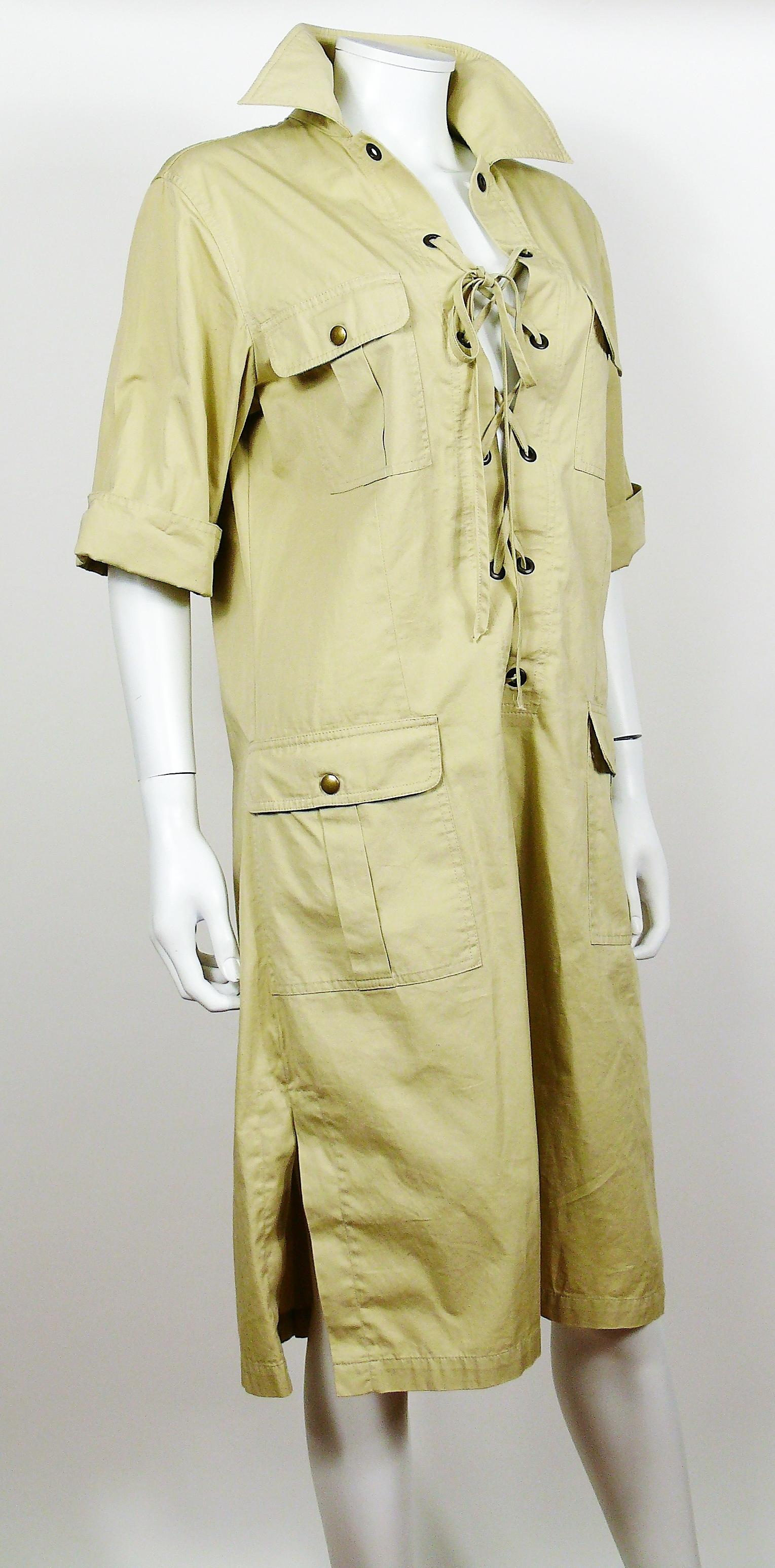 YVES SAINT LAURENT vintage iconic SAFARI dress.

This dress features :
- Lace-up front construction with metal eyelets and matching fabric rope.
- 4 front pockets with snap button closure.
- Side slits.
- Half length sleeves.
- Unlined.

Label reads