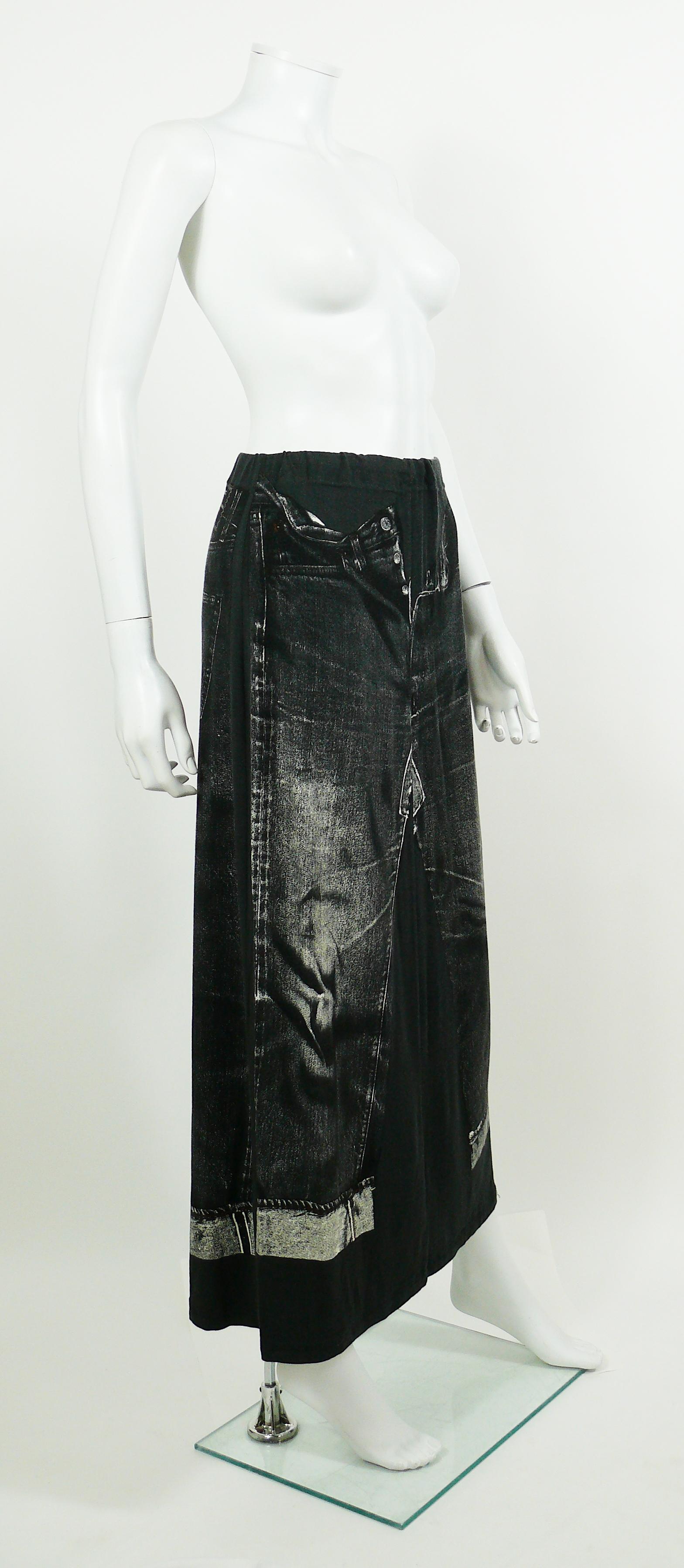 JEAN PAUL GAULTIER dark grey jersey maxi skirt featuring an X-RAY screen trompe l’œil jeans on front and back.

This skirt features :
- Dark grey jersey background featuring distressed black/white x-ray screen trompe l’œil jeans.
- Maxi length.
-