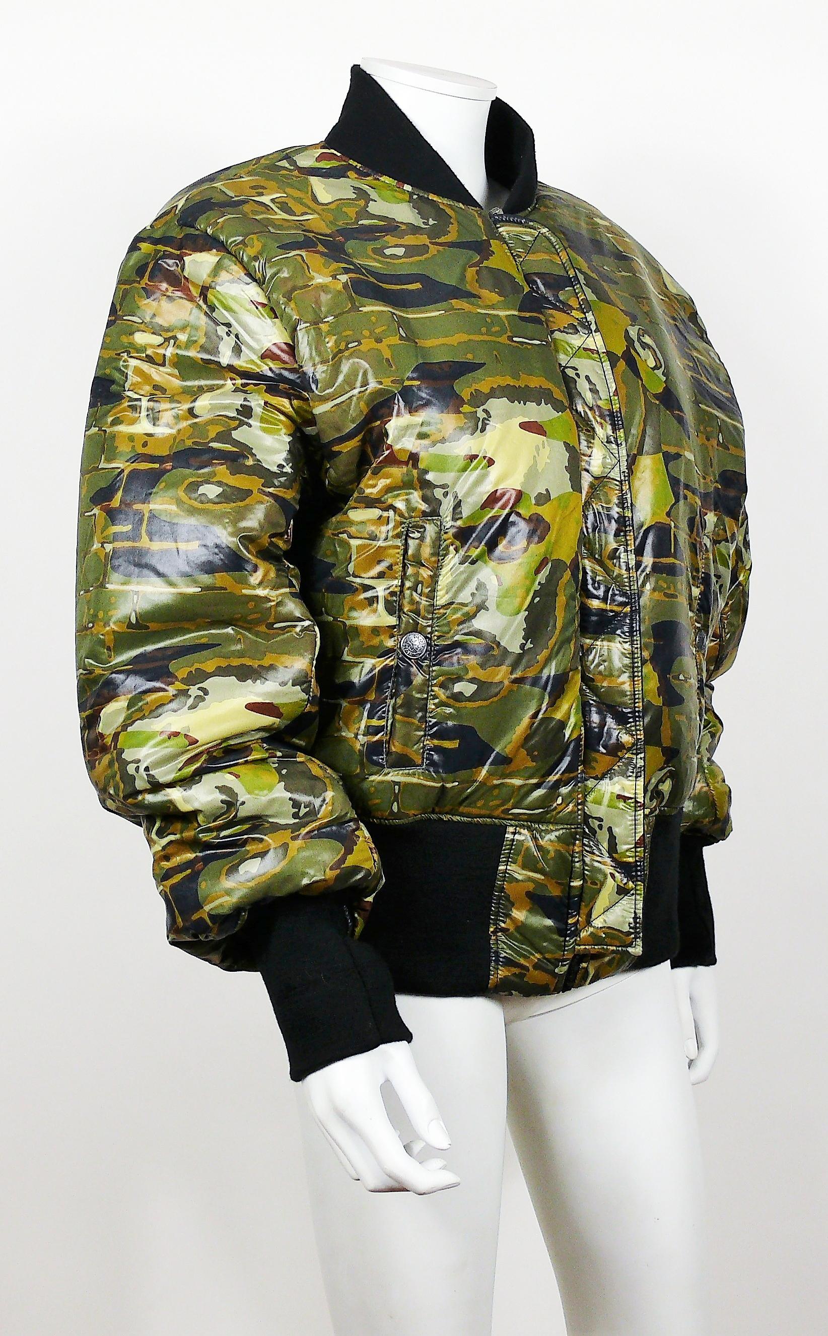 JEAN PAUL GAULTIER vintage reversible bomber jacket featuring a camouflage design with faces on one side, black nylon on the other side.

Label reads GAULTIER JEAN'S.

Missing size tag.
Please refer to measurements.

Missing composition