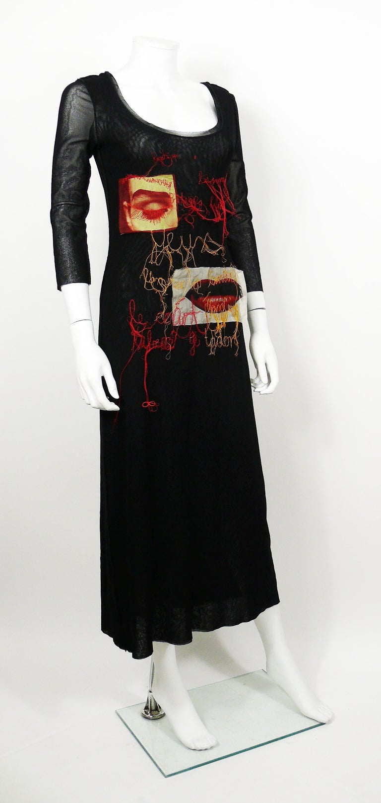 JEAN PAUL GAULTIER vintage rare black mesh dress with eye and mouth appliques featuring red and yellow embroideries ane exposed knit seams.

Sheer sleeves (please note that, apart from the sleeves, this dress may have a little sheer effect