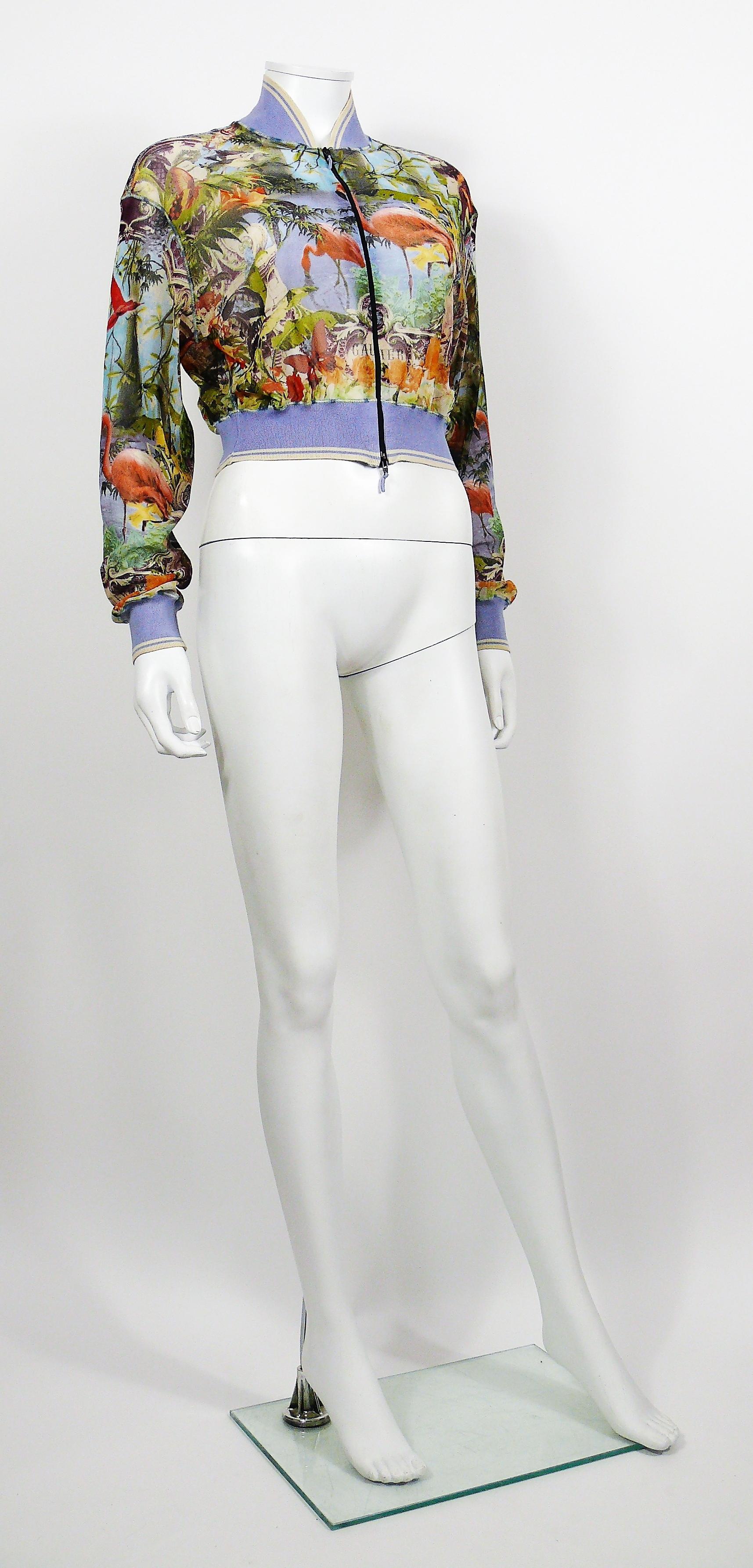 JEAN PAUL GAULTIER vintage tropical print sheer FUZZI bomber jacket.

This jacket features :
- Multicolored tropical print with flamingos, butterflies, birds and architectural elements.
- Front zipper closure.
- Cropped length.
- Knitted collar and