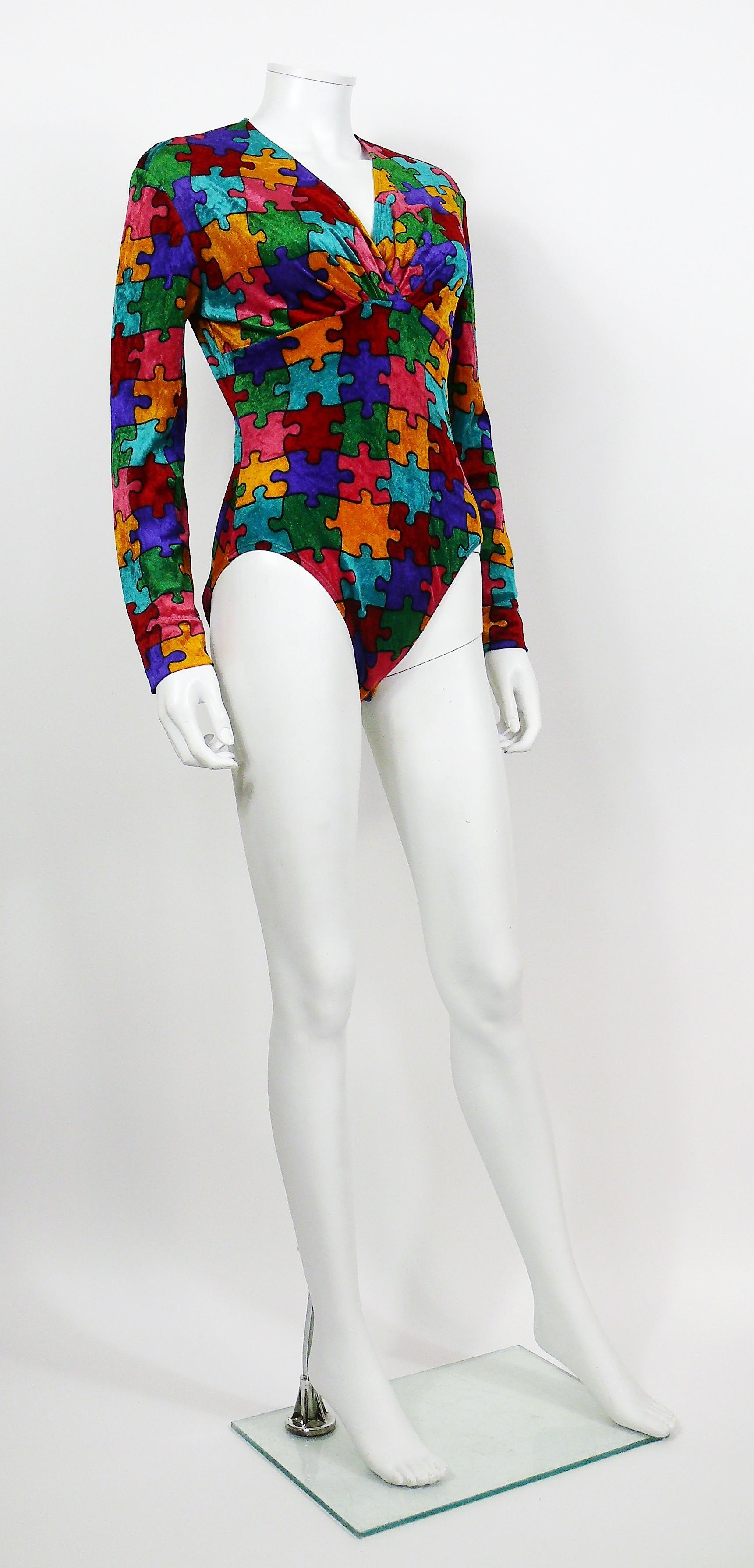 MOSCHINO vintage rare iconic multicolored puzzle print bodysuit.

This bodysuit features :
- Soft pluch fabric printed with a multicolored puzzle pattern.
- V neckline.
- Long sleeves.
- Snap button closure.

Label reads CHEAP AND CHIC by