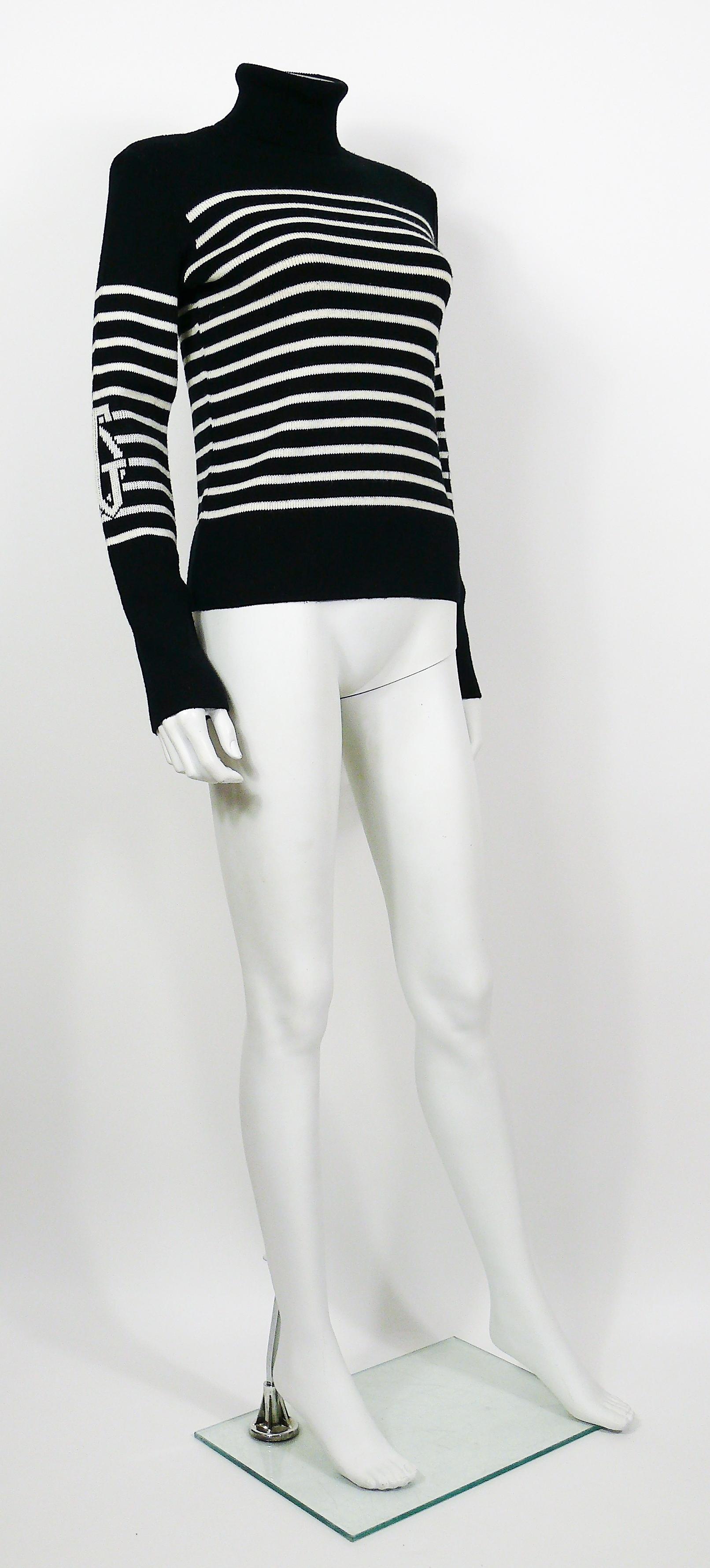 JEAN PAUL GAULTIER vintage iconic wool blend black/white matelot sweater featuring large JPG monogram on each sleeve.

Turtle neck.
Long sleeves.

Label reads JPG JEAN'S.
Inner label was removed.

Made in Italy.

Composition label reads : 50%