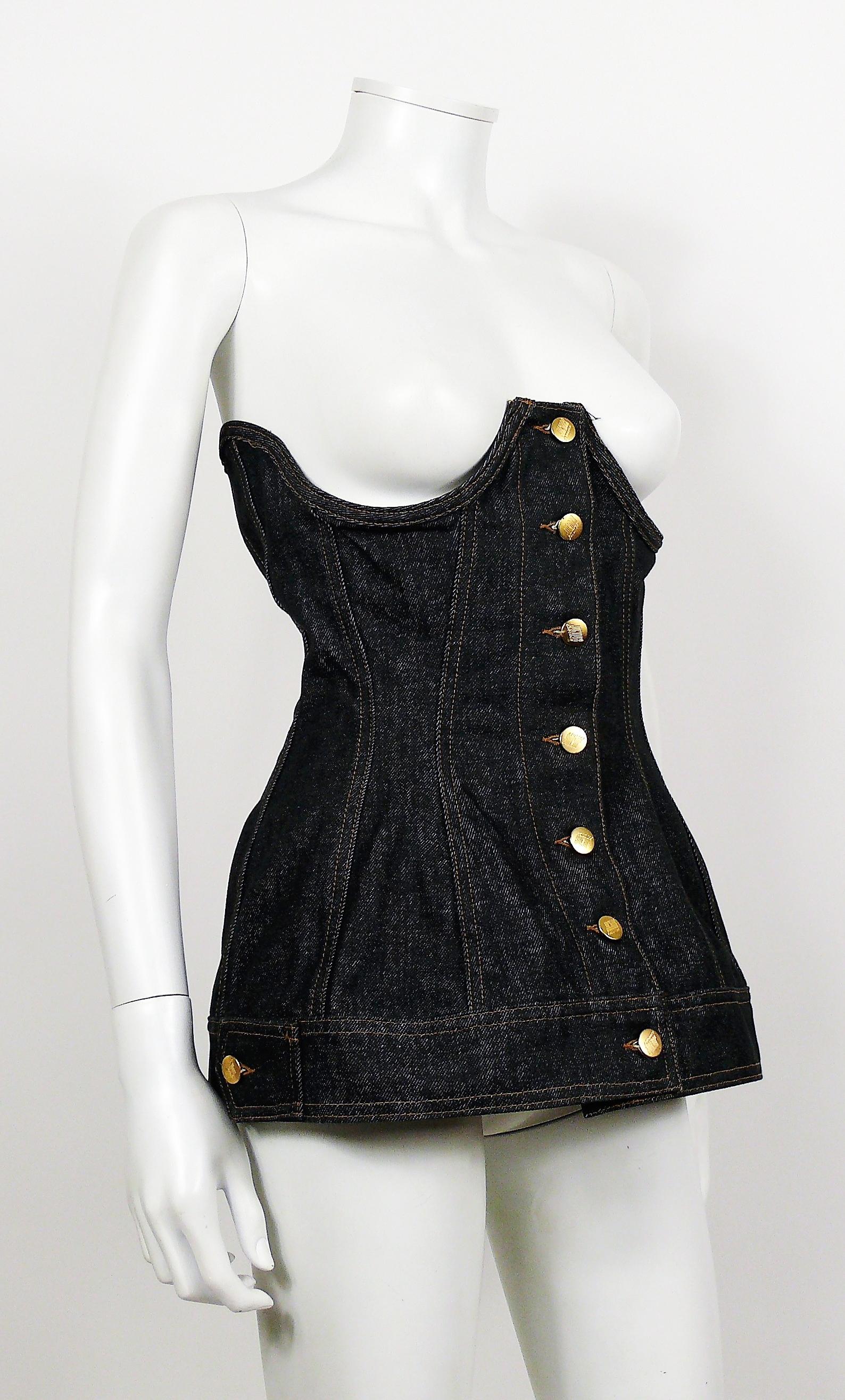 JEAN PAUL GAULTIER vintage black denim boned underbust corset.

Front buttoning.
Corset lace-up back fastening.
Boned underbust.

Label reads JUNIOR GAULTIER Made in Italy.

Composition label reads : 100 % Cotton.

Size label reads : 46.
Please