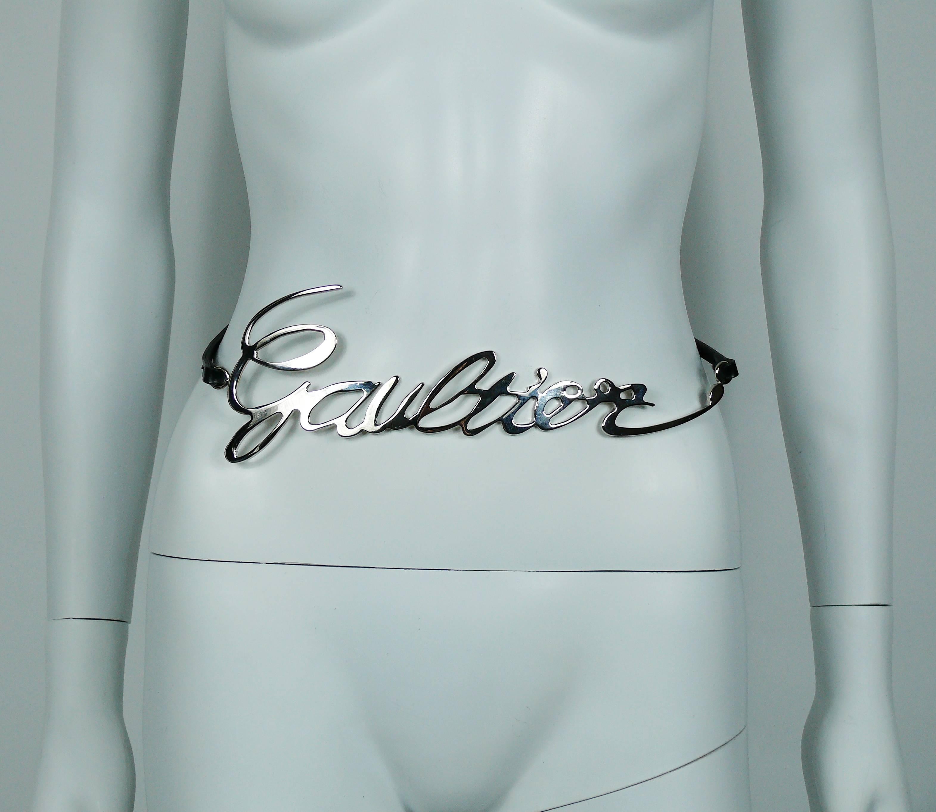 JEAN PAUL GAULTIER great cursive logo metal chrome belt with a black leather cord that ties in the back.

Similar model on JEAN PAUL GAULTIER Spring Ready to Wear runway 2013.

One size fits all.
Can be worn in several ways.

Indicative measurements