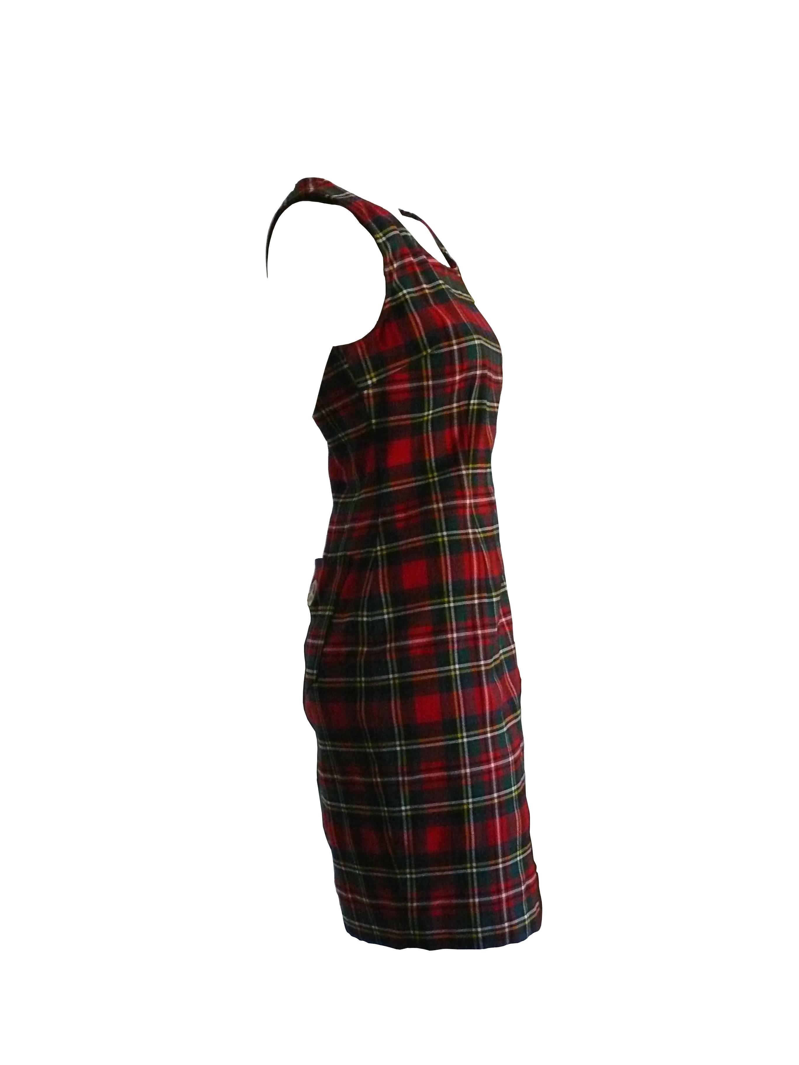 MOSCHINO vintage tartan plaid sheath mini day dress from the 1990s.

This dress is unlined with back pockets and a side zip closure. Peace symbol on one pocket.

Label reads Moschino Jeans Made in Italy.

Color: red / green / blue / yellow /