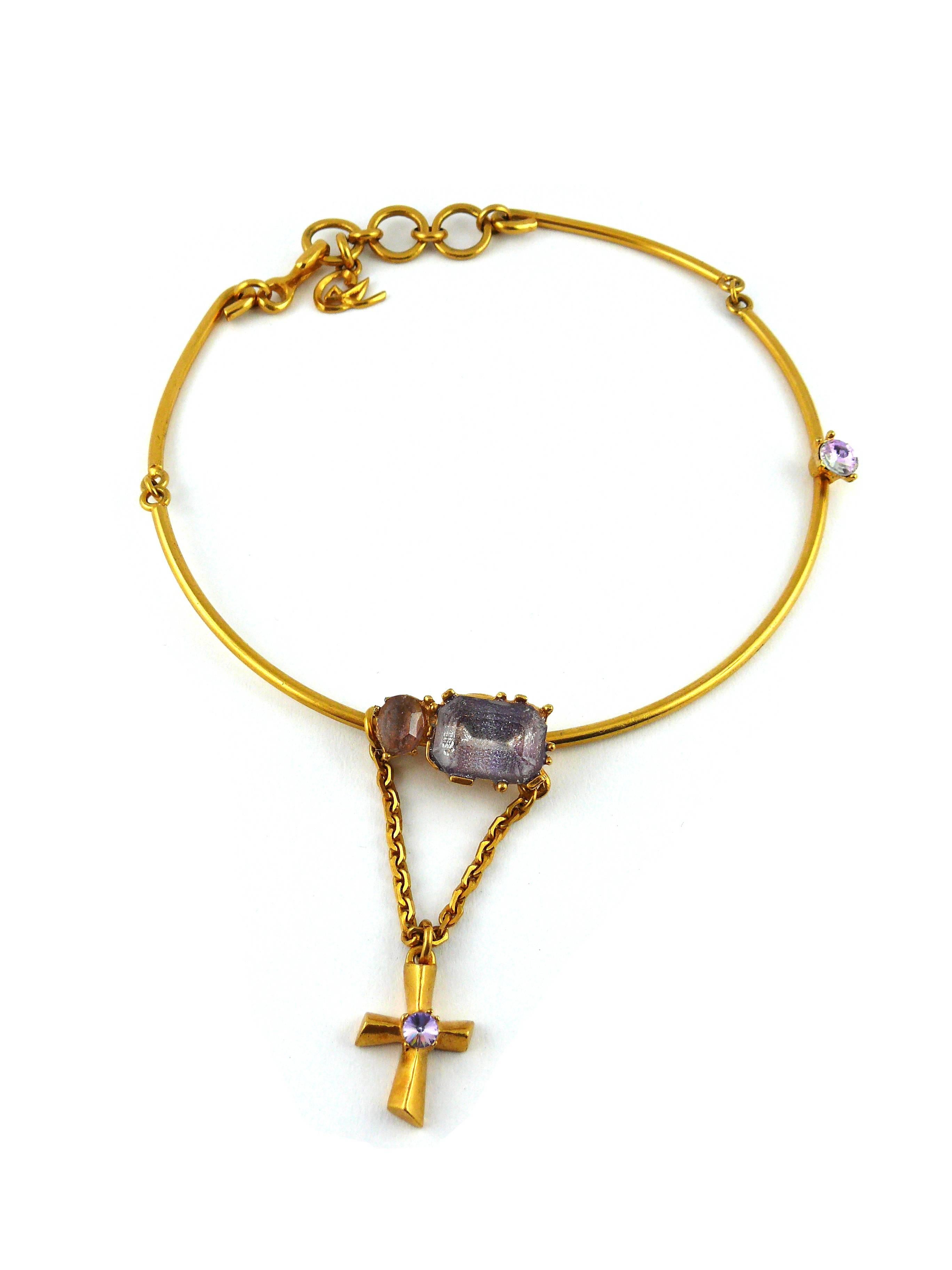 CHRISTIAN LACROIX asymetrical vintage jewelled chocker necklace featuring a cross charm.

Gold tone metal with crystal embellishment.

Marked Christian Lacroix CL Made in France.

Indicative measurements : maximum circumference approx. 38 cm
