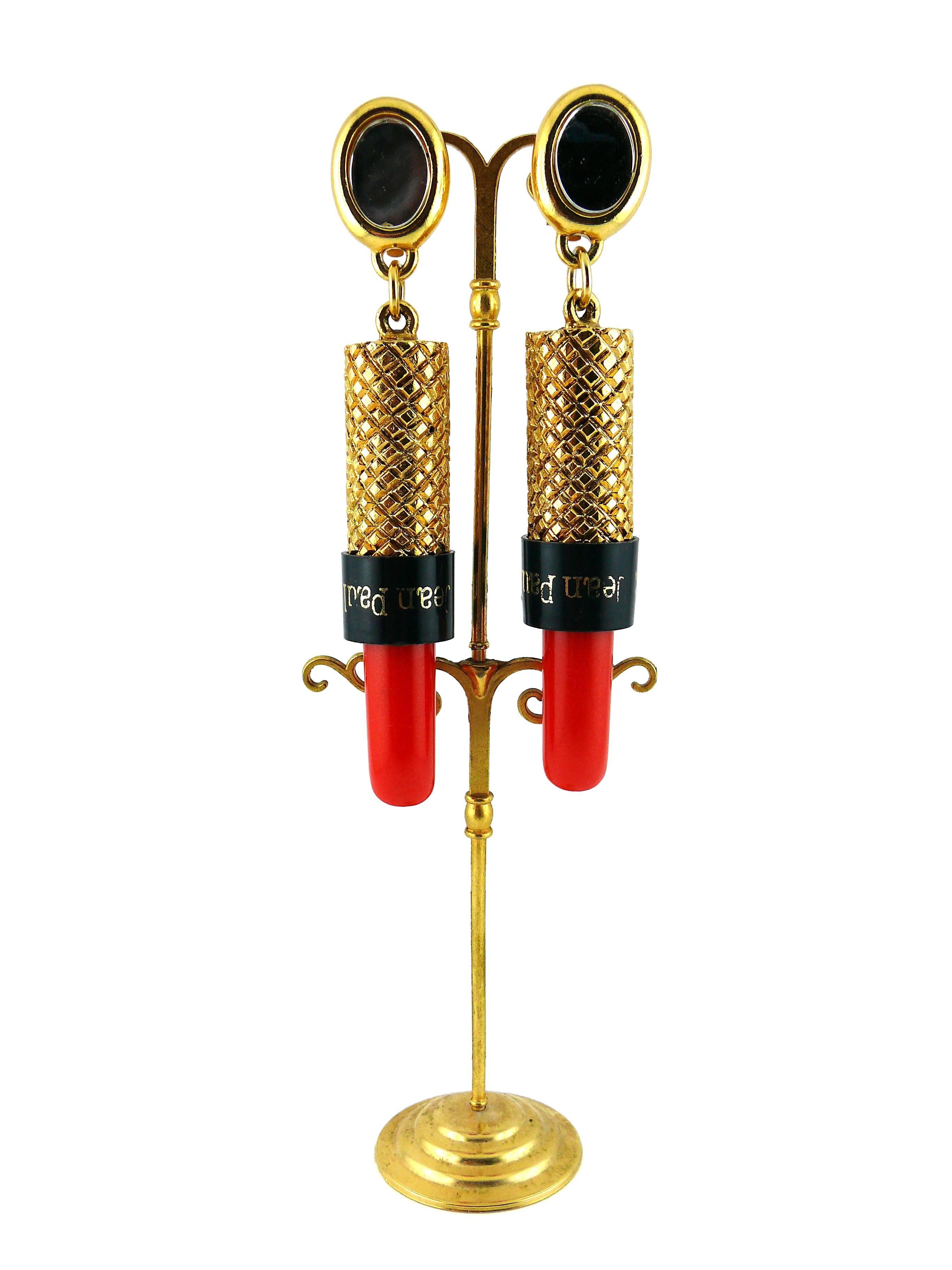 JEAN PAUL GAULTIER vintage dangling earrings featuring a lipstick topped by an oval mirror.

Marked Jean Paul Gaultier.

Note
As a buyer, you are fully responsible for customs duties, other local taxes and any administrative procedures related