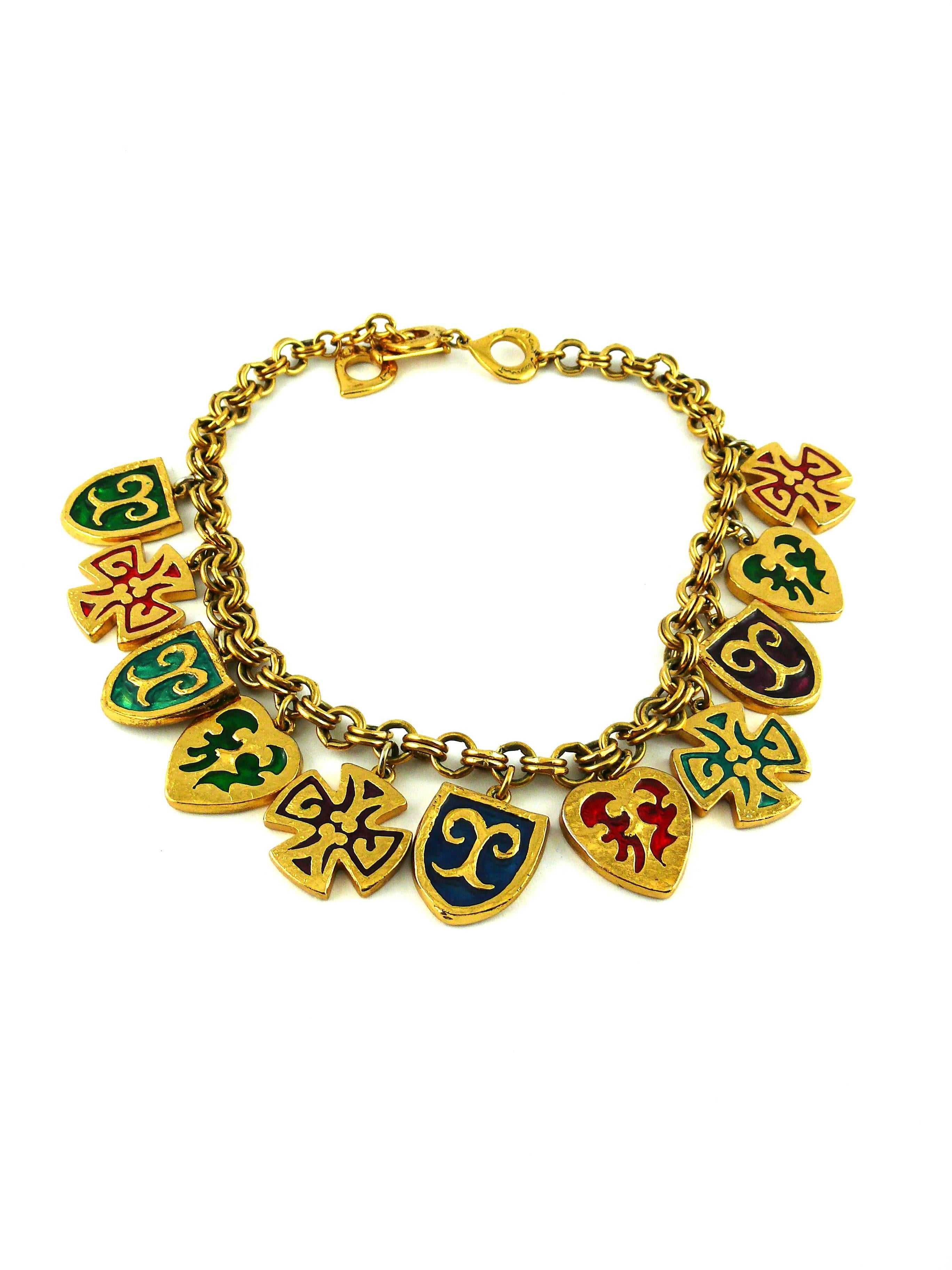 YVES SAINT LAURENT vintage rare multicolored enamel charm necklace. Created in the Ateliers of parurier ROBERT GOOSSENS.

Gold tone double link chain with enamel cross, heart and blazon charms.

Heart 