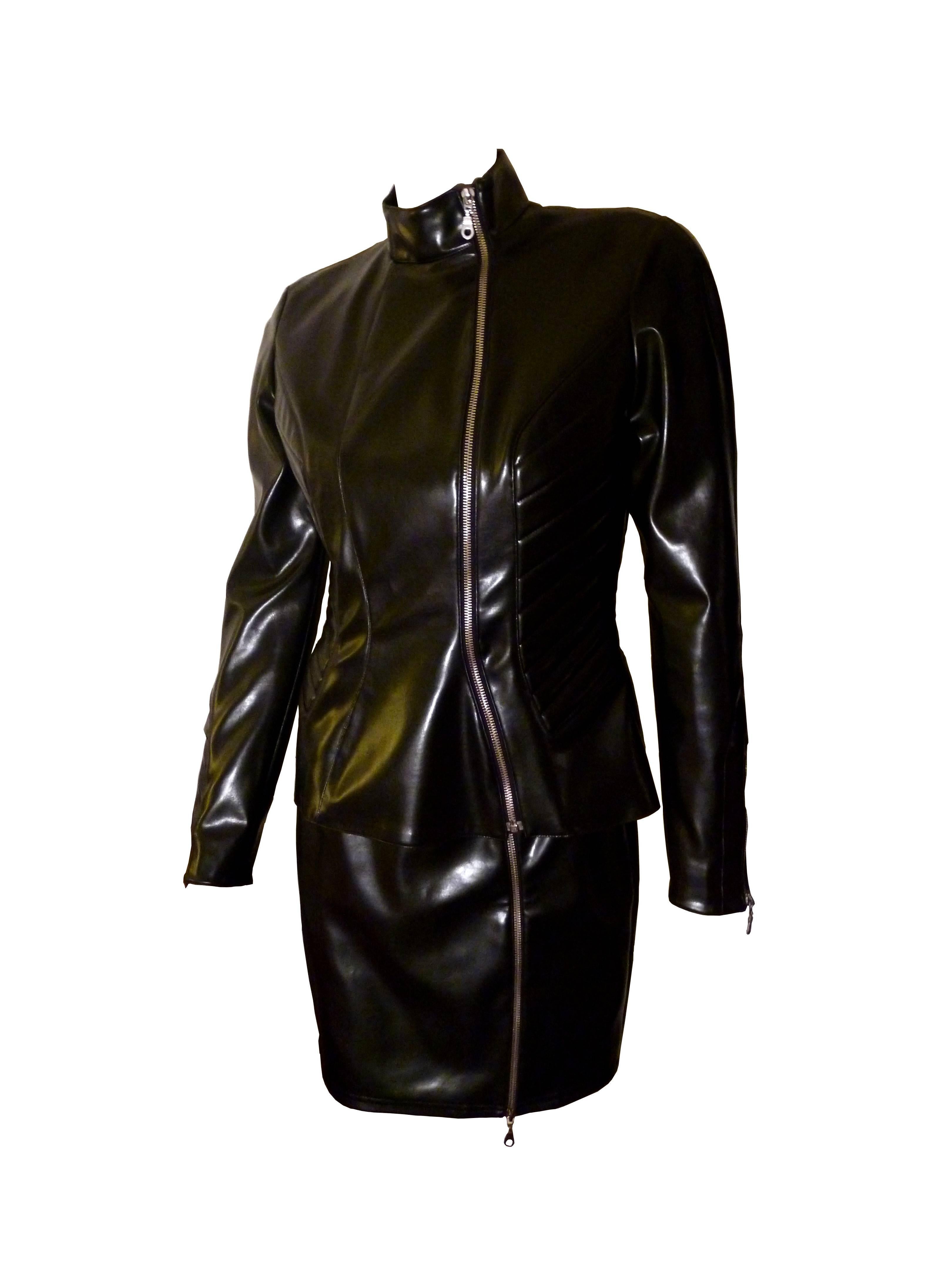 THIERRY MUGLER vintage black stretch rubber jacket and skirt.

Great sculpted jacket and skirt, typical from Mugler's cut.

Fitted jacket with armor style matelasse details on the sides.

Long asymetrical zip at the front of the jacket and