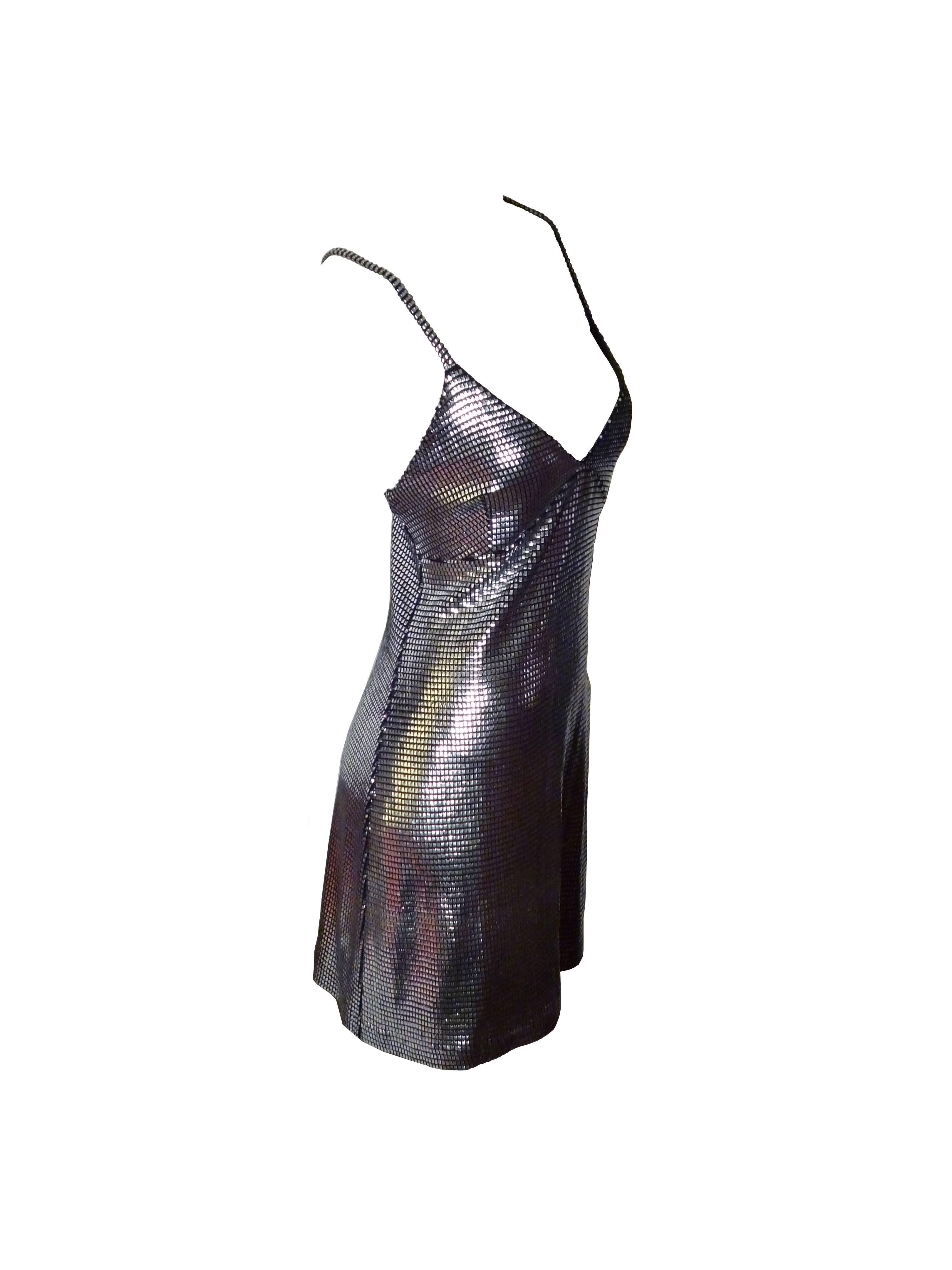 PACO RABANNE sexy silver foil grid little dress.

Top surface is silver foil printed creating a metallic chain mail effect on a black knit spandex base.

Cross back shoulder straps.

Label reads PACO RABANNE Paris.

Size tag reads :