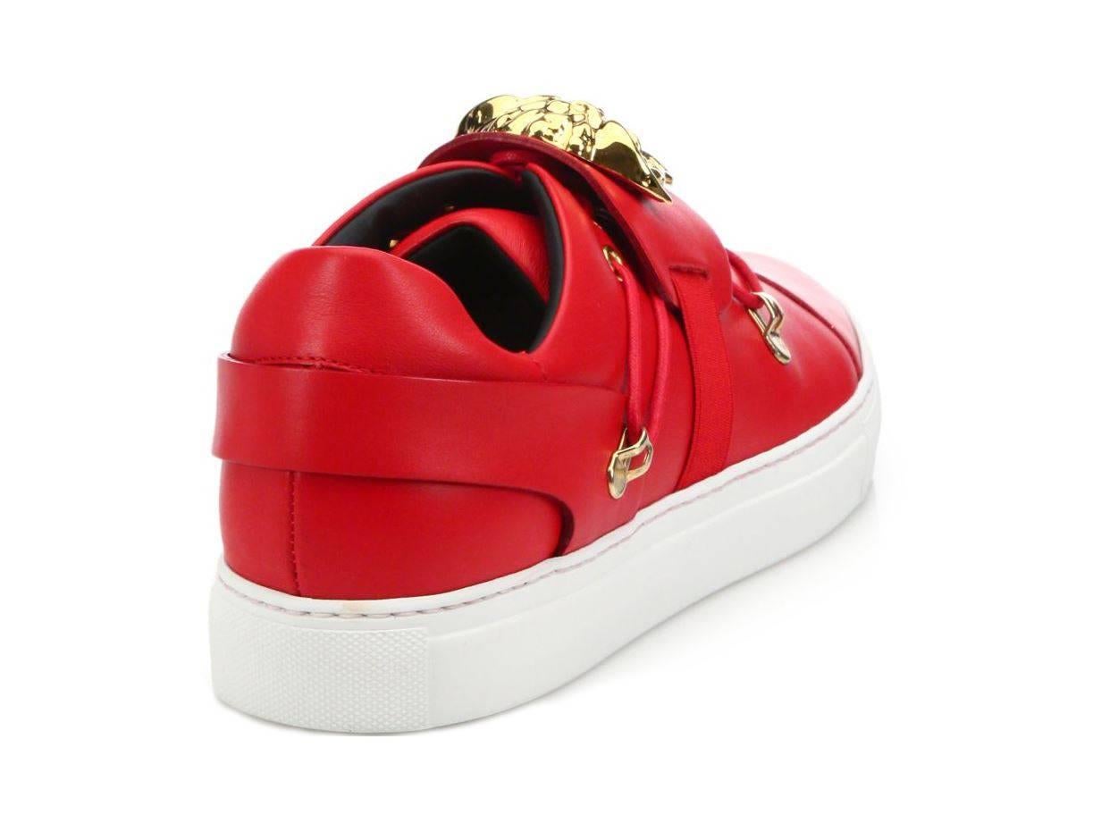 BRAND NEW 
VERSACE 

Palazzo sneakers 

This shoe is embodied in true Versace-style and
 features red leather and iconic gold Medusa. It wouldn’t be Versace without it.

Made in Italy

Sizes 43- US 10 and 44 - US 11

Brand New, in the Box. 