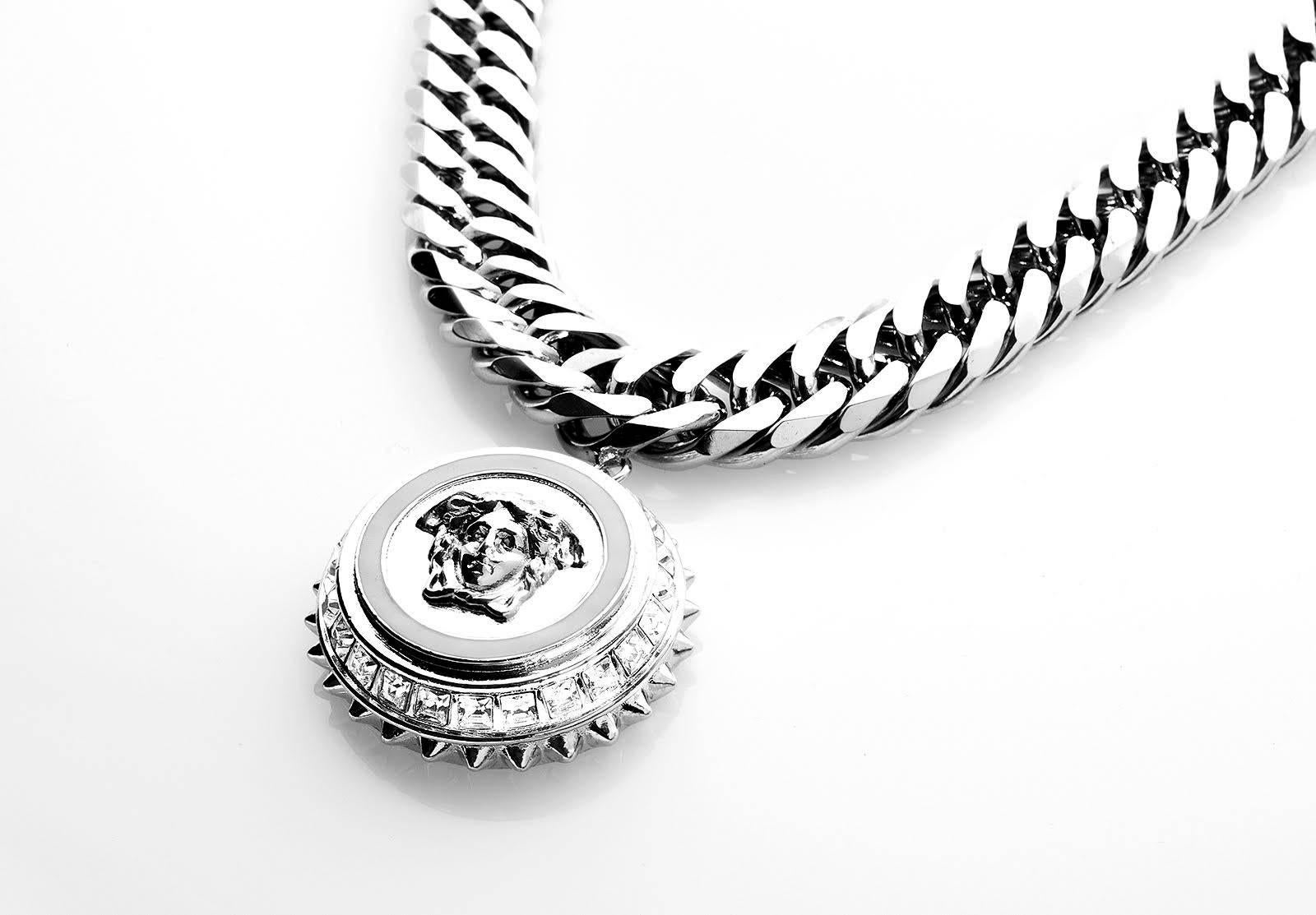  VERSACE CRYSTAL EMBELLISHED CHAIN  NECKLACE WITH  MEDUSA CHARM

This strong Medusa necklace will add a Versace tough touch to even the most basic outfit.

100% Metal

Crystals

Brand new. In original box.