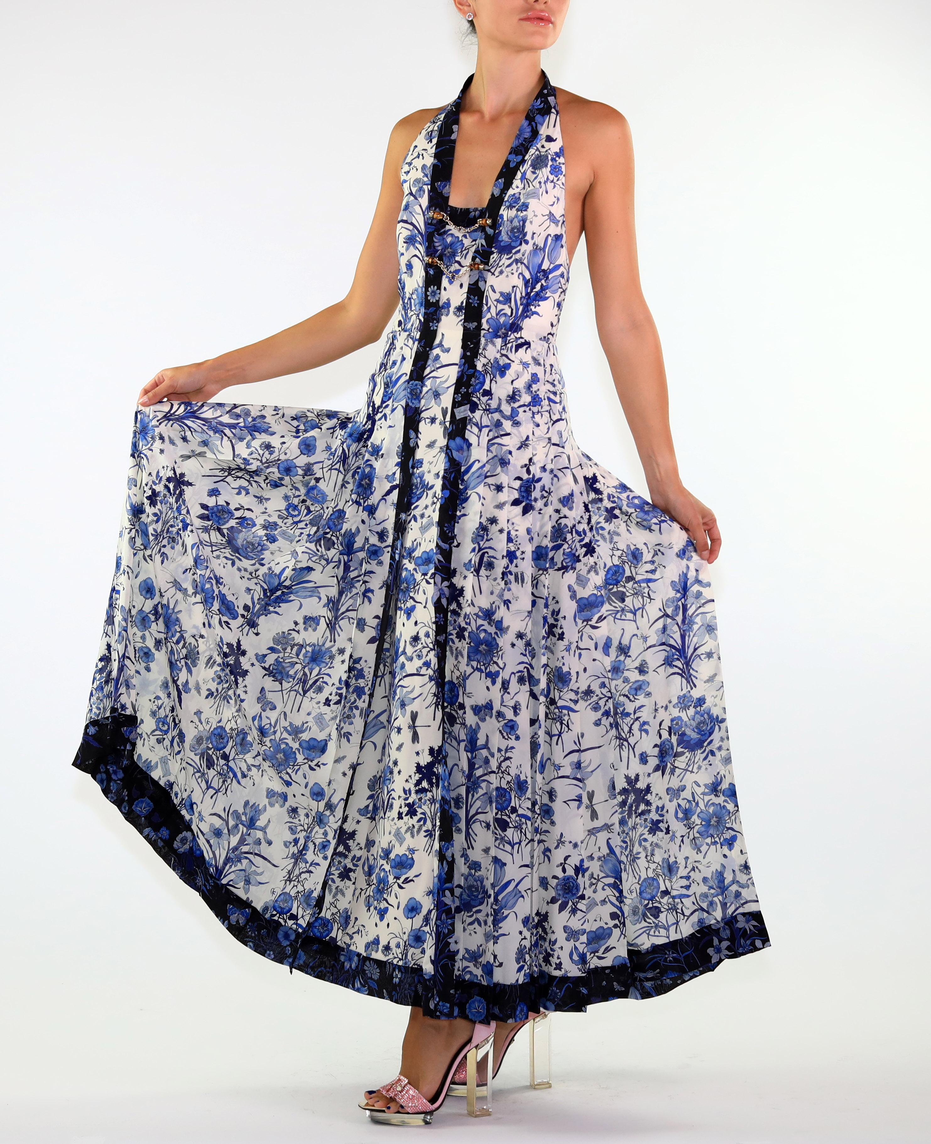 Gucci Dress 

Rich Flora print makes a glamorous appearance in this fabulous dress. Elegant chains with bamboo detail accent the exquisite pattern. The pleating adds movement and charm.

The open back create a very daring silhouette.
100% silk